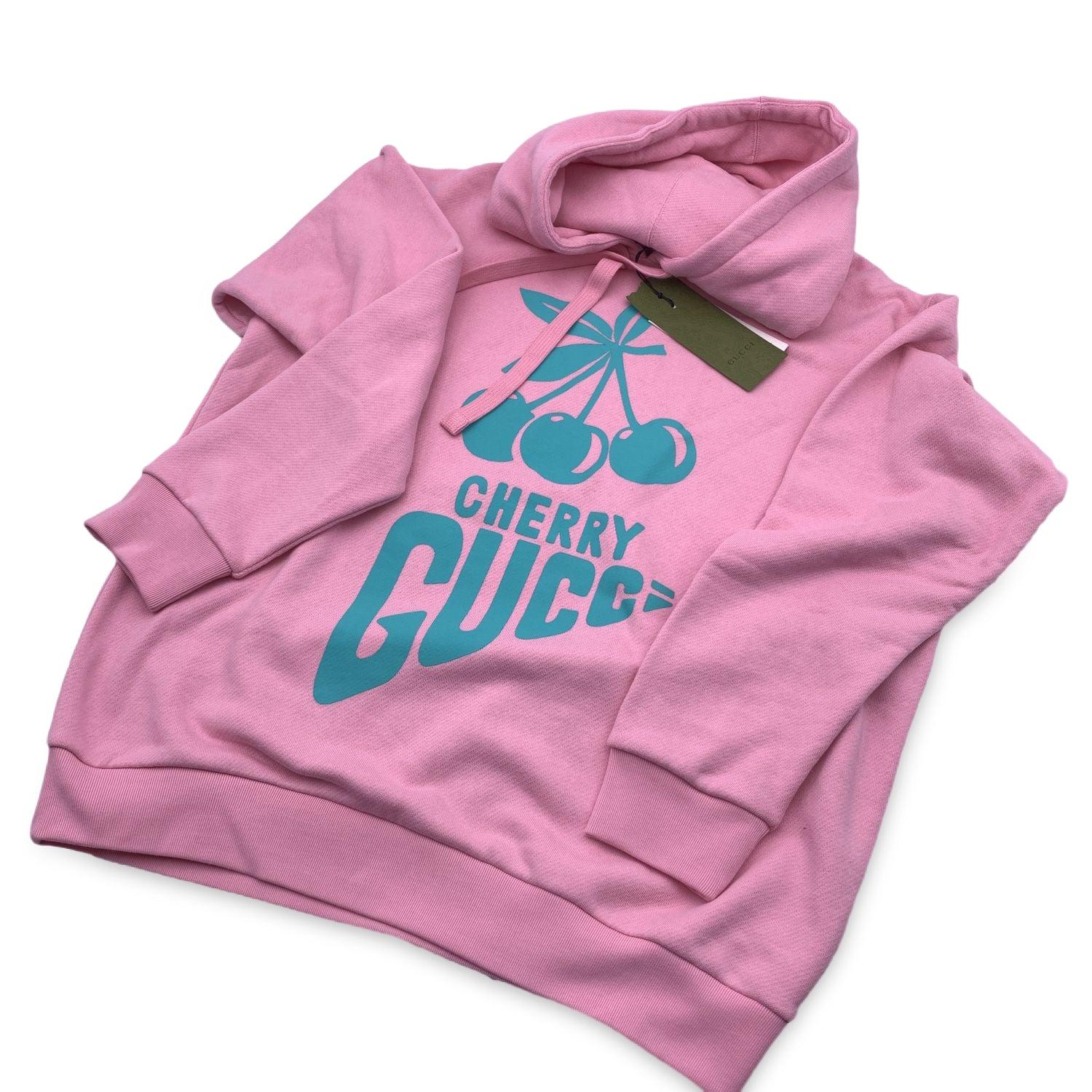 Gucci light pink heavy fleece cotton jersey sweatshirt with 'Cherry Gucci' print . Hooded. Adjustable drawstring at neckline. Oversized cut. Made of 100% cotton. Size: M (The size shown for this item is the size indicated by the designer on the