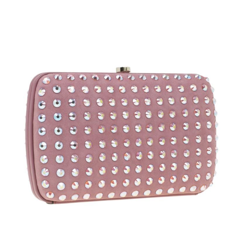 Part of the signature Broadway collection, this Gucci bag will shimmer and shine under the spotlight. Its muted pink leather is studded with crystals, and opens up to a matching pink leather interior with one zipped pocket, one patched, and six