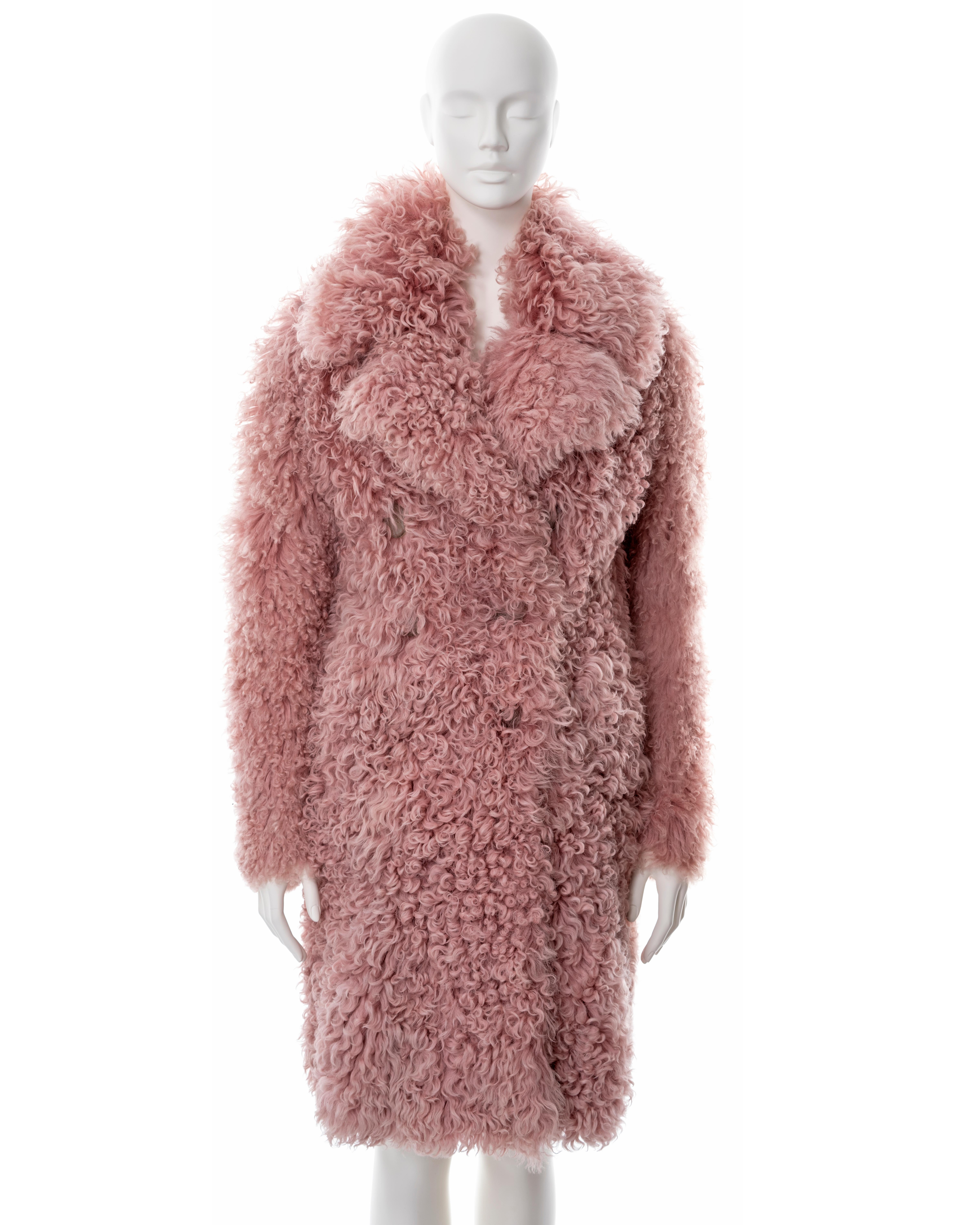 ▪ Gucci pink curly shearling coat 
▪ Fall-Winter 2014
▪ Sold by One of a Kind Archive
▪ Double-breasted 
▪ Black leather interior 
▪ Large collar 
▪ Size approx. Small 
▪ Made in Italy 

All photographs in this listing EXCLUDING any reference or