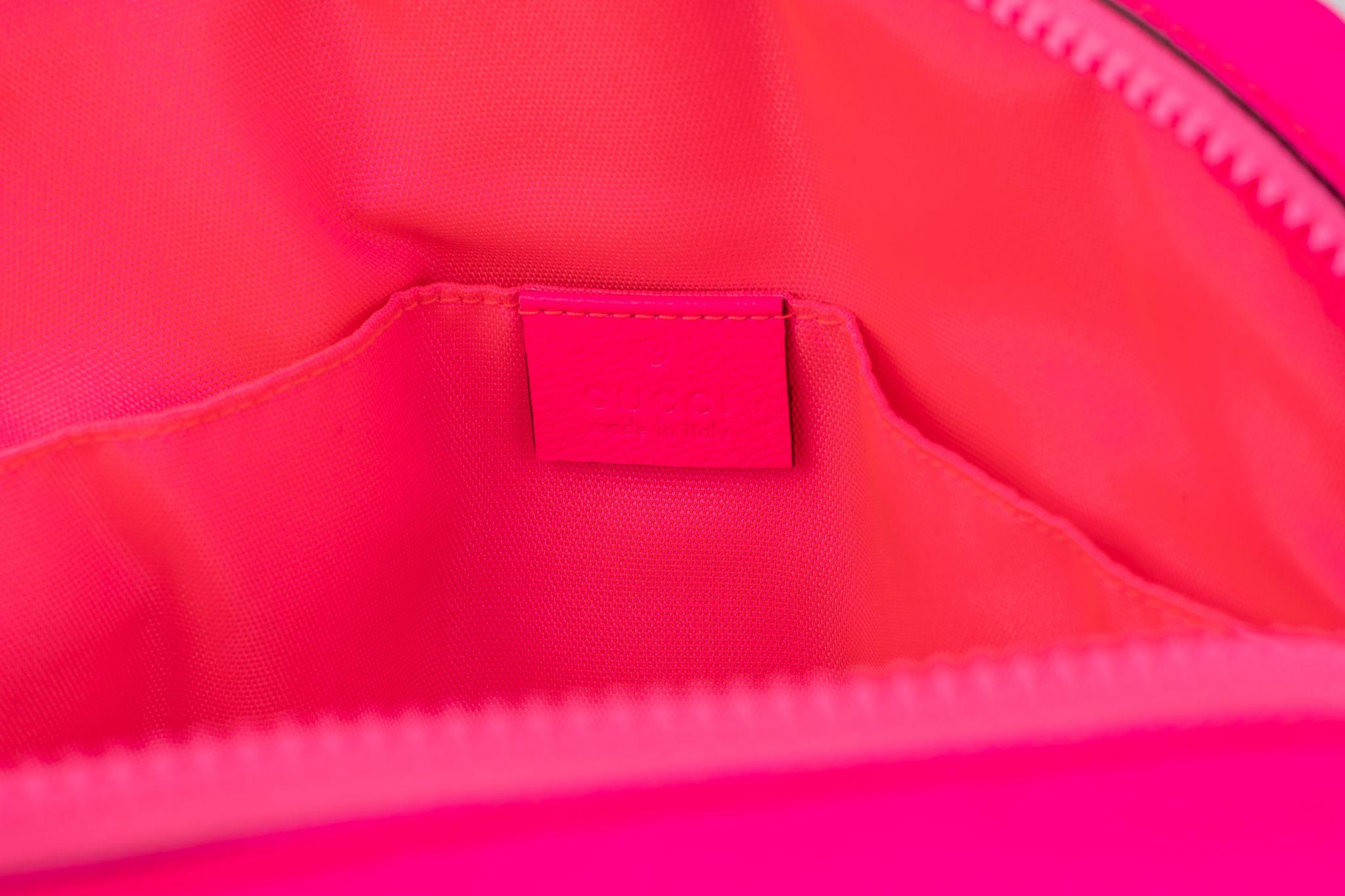Gucci new pink fluo pvc fanny pack with flora design. Unworn condition.
Comes with original dust cover.