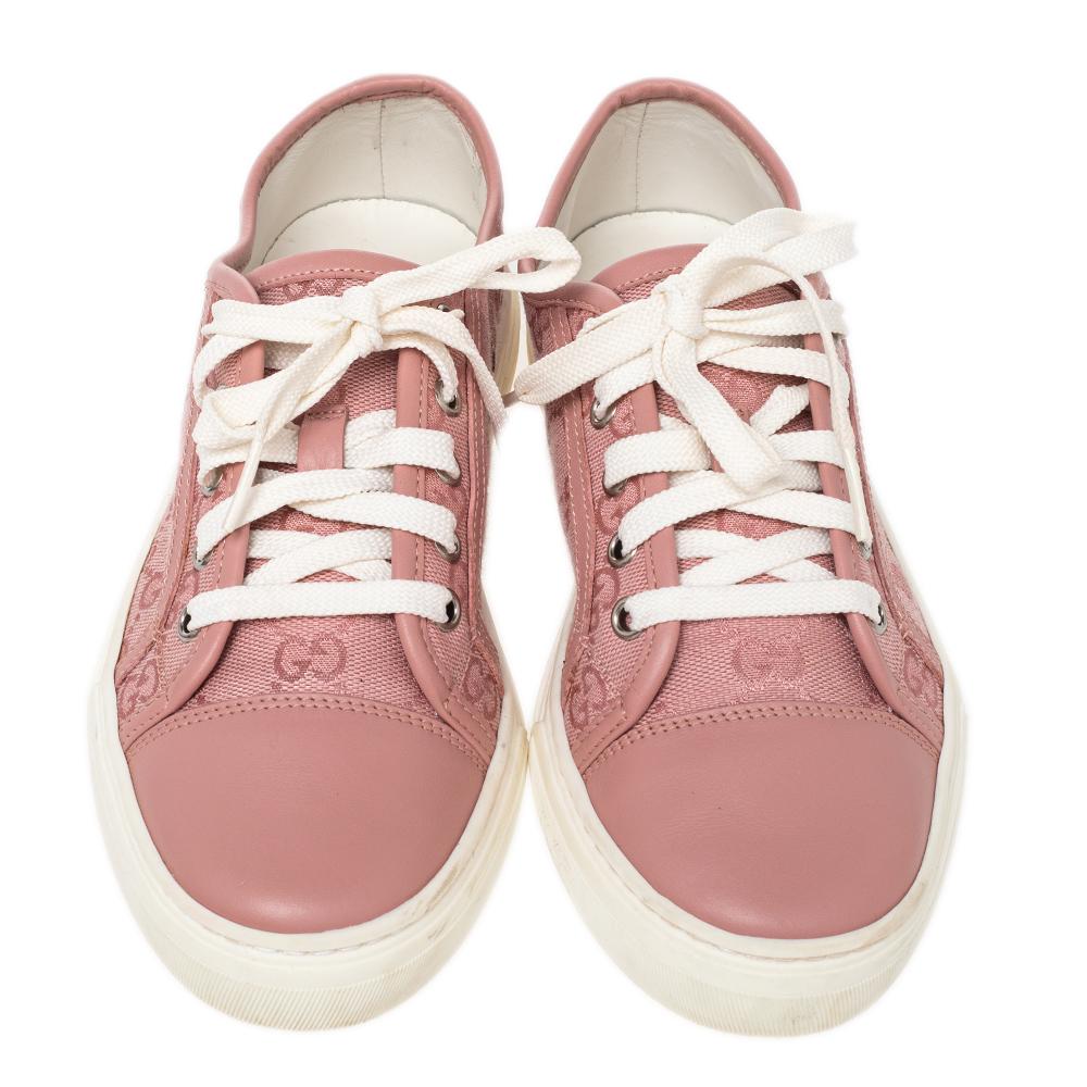 These Gucci sneakers are simple yet stylish. They've been crafted from GG canvas as well as leather and designed with simple lace-ups. Set on rubber soles, these sneakers are just perfect to ace one's casual style.

