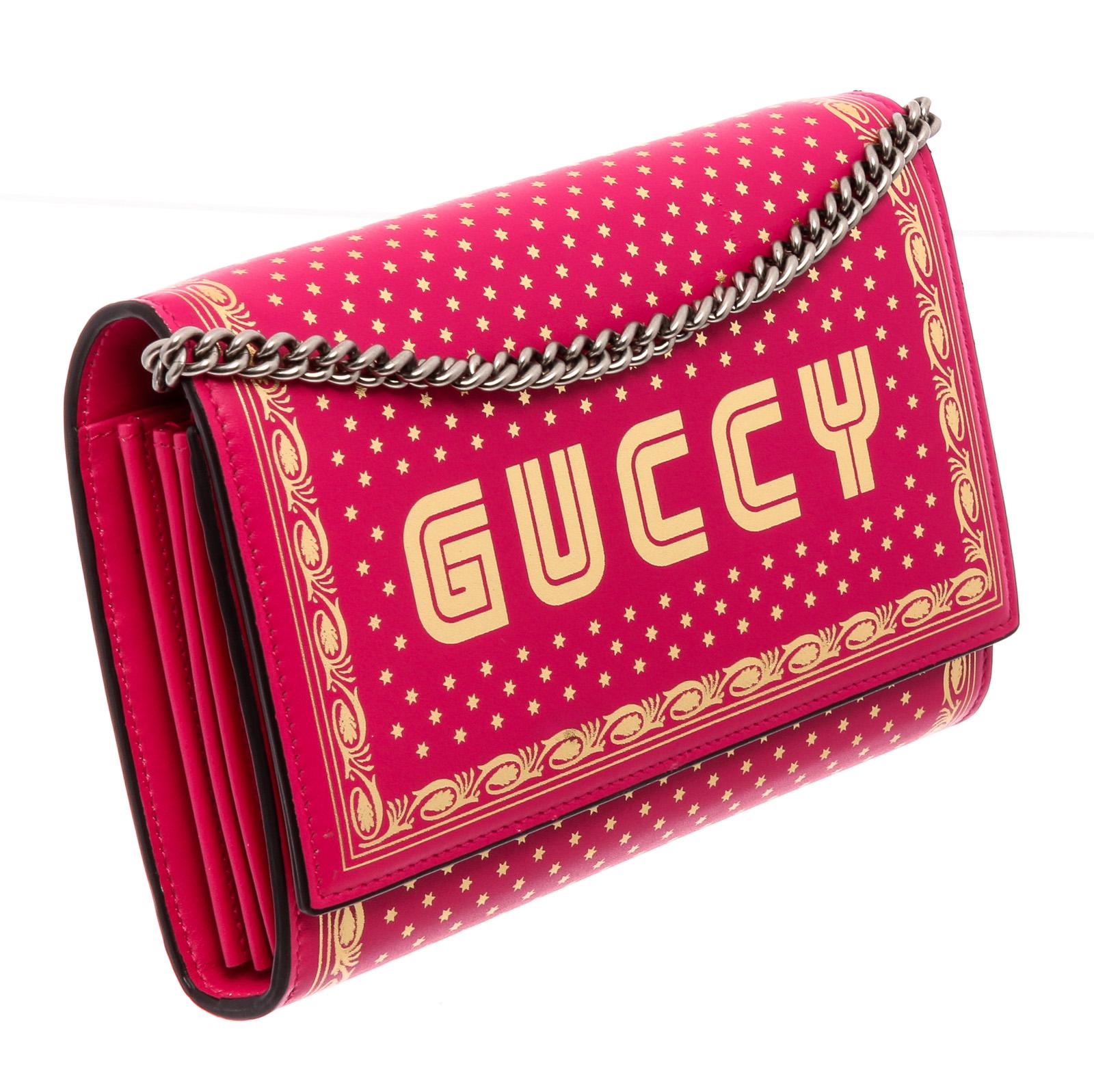 Gucci Chain Wallet shoulder bag is crafted of bright pink calfskin leather with gold detailing and 
