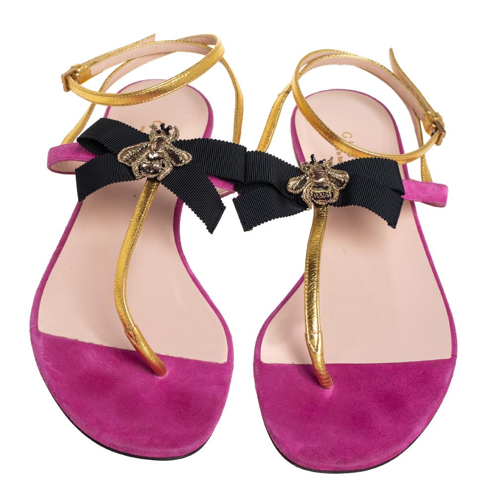 A classic pair of flat thong sandals is a must-have in every collection and when the design is by Gucci, it is sure to add a statement on luxury to one's summer wardrobe. These thong flats for women are constructed in gold leather and pink suede.