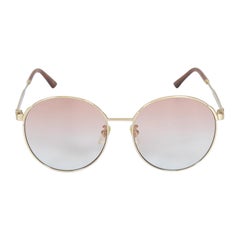 Gucci Sonnenbrille mit rundem Gestell und rosa Farbverlauf