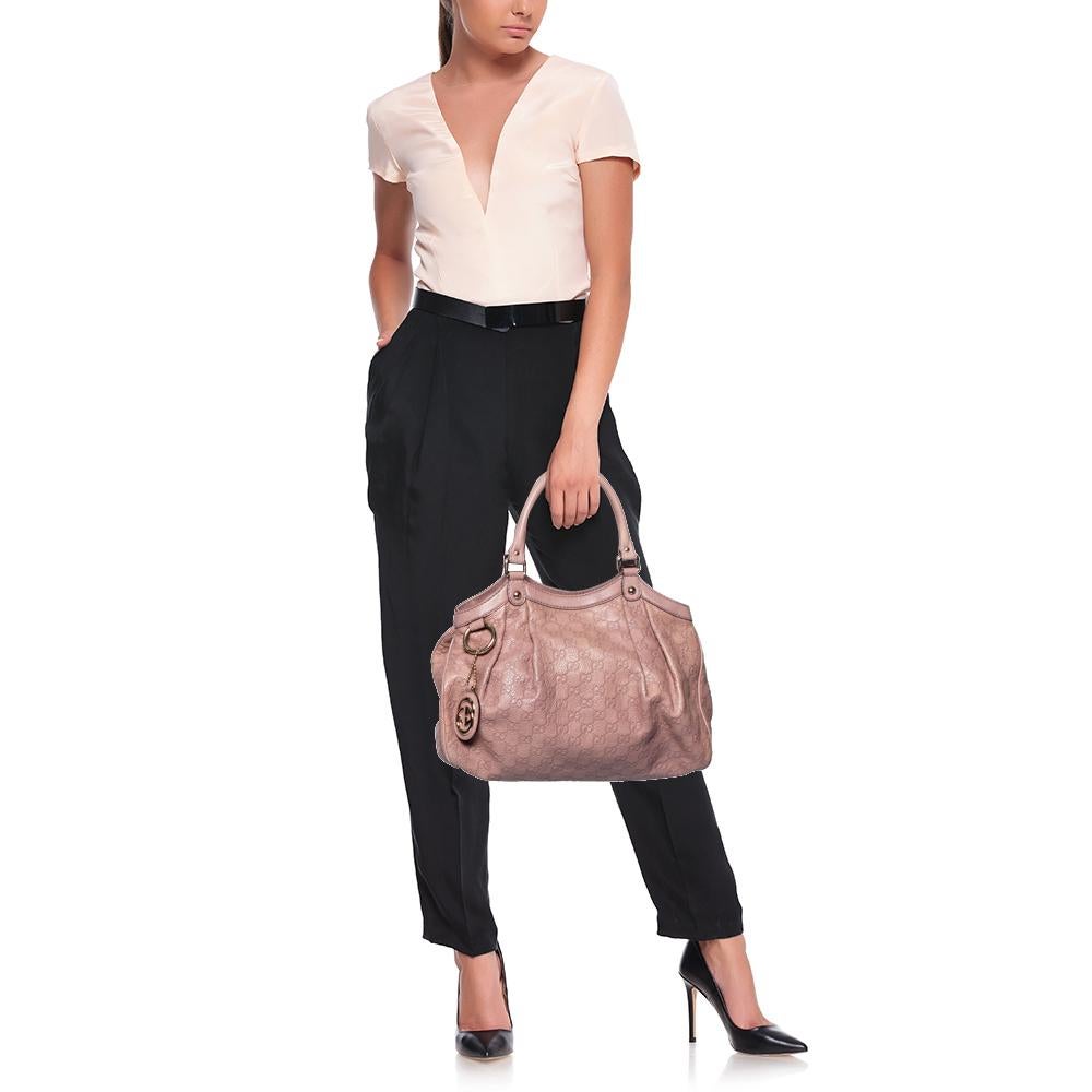 The Sukey is one of the best-selling designs from Gucci, and we believe you deserve to have one too. Crafted from Guccissima leather in a pink shade and equipped with a spacious interior, this bag is ideal for you and will work perfectly with any