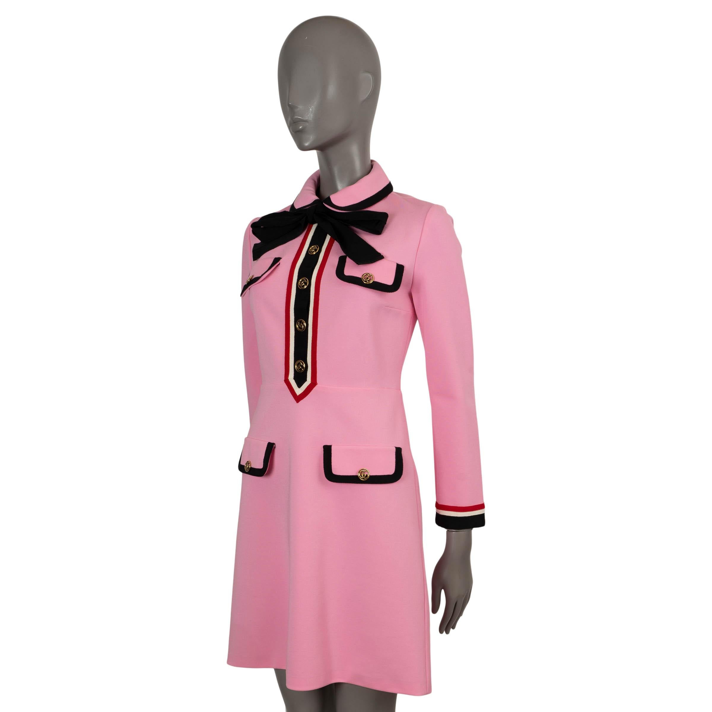 100% authentic Gucci mini dress in pink jersey. The design features webbed grosgrain trims, gilded gold-tone monogram buttons and pussy-bow ribbons that tie neatly beneath a Peter Pan collar. Opens with a back zipper and is unlined. Has been worn