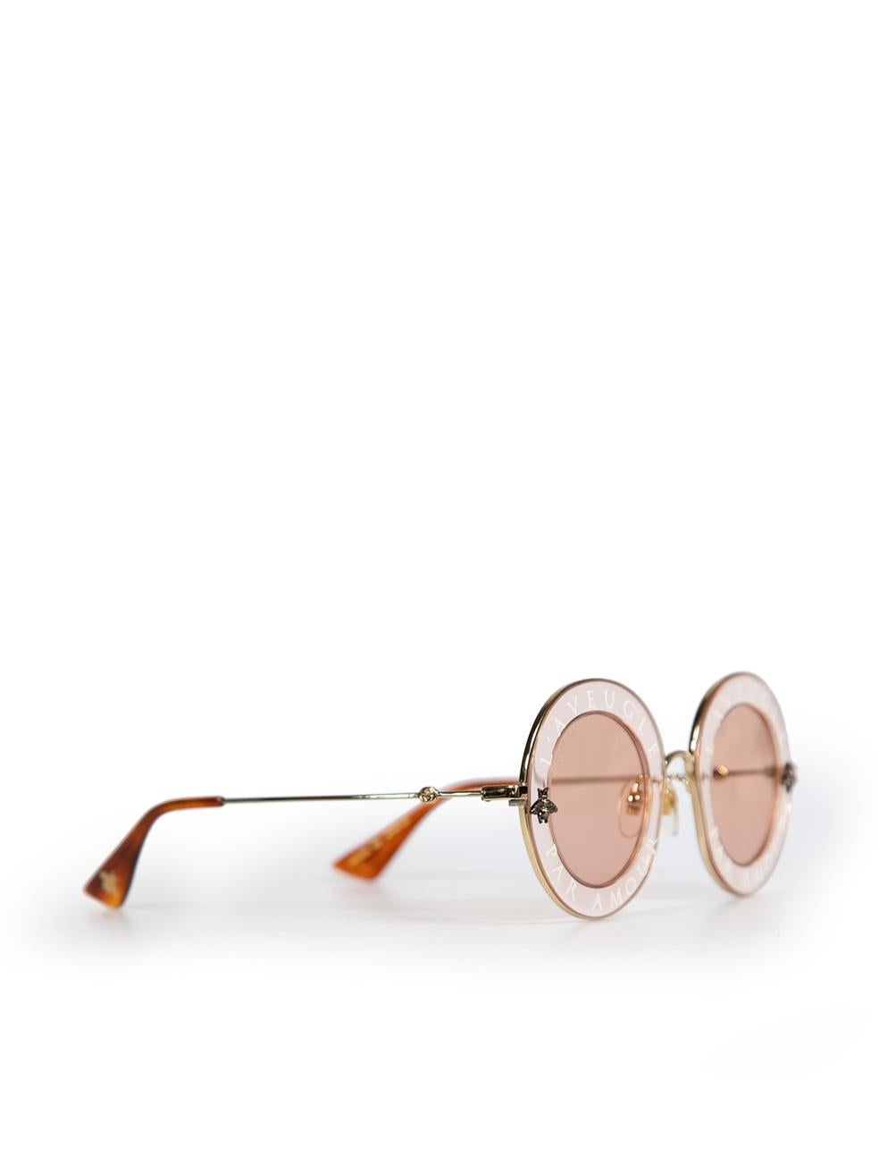 CONDITION is Very good. Minimal wear of the sunglasses is evident. There is a small scratch on the right lens and minor scratches on the gold trimming around the lens' on this used Gucci designer resale item. This item comes with the original case.
