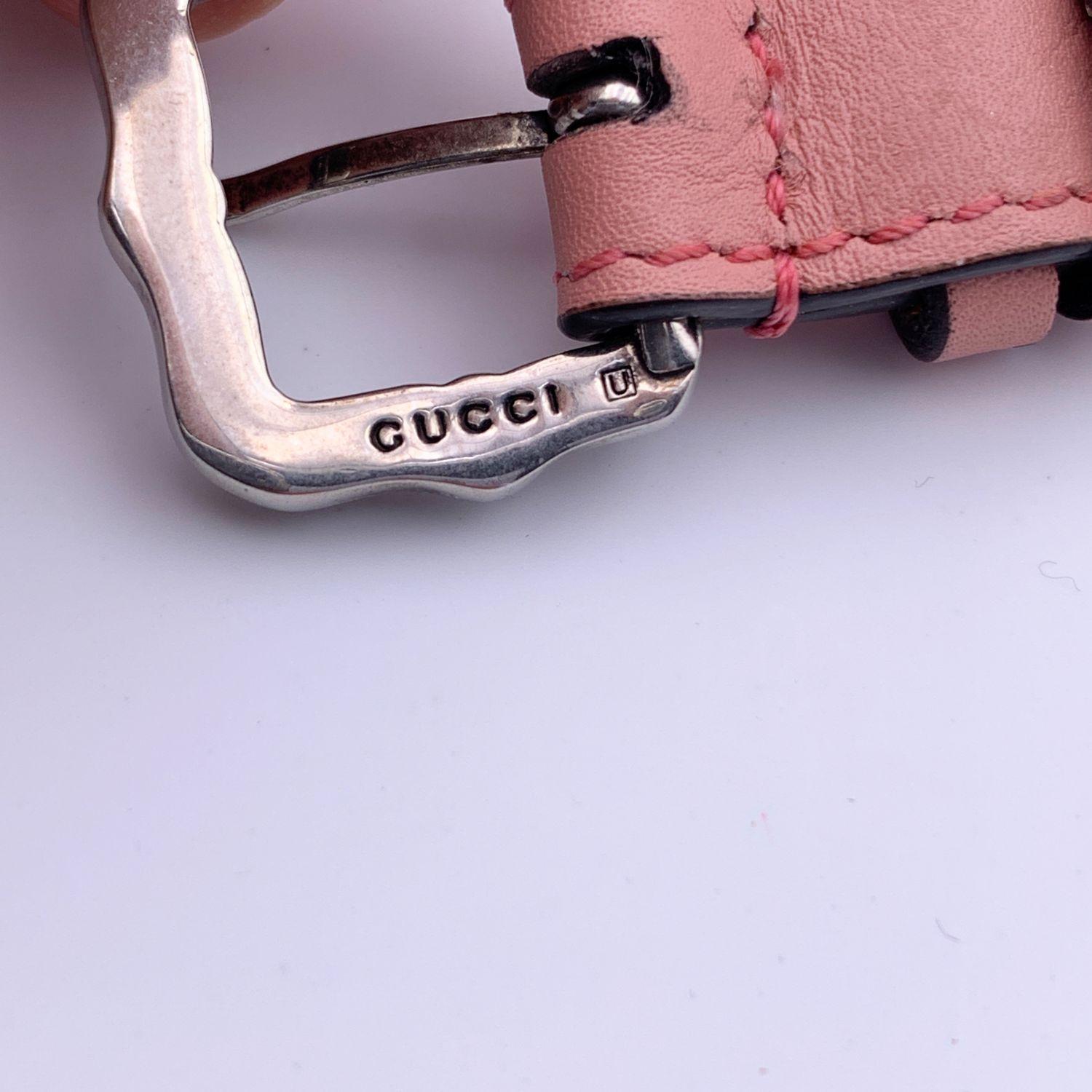 Gucci pink leather necklace with pink, grey and white pearl in different sizes. Silver metal tiger head detailing. Buckle closure. 4 adjustable holes. Total length: 18 inches - 45.72 cm. Height: 0.6 inches - 1.6 cm. Made in Italy. 'Gucci' signature