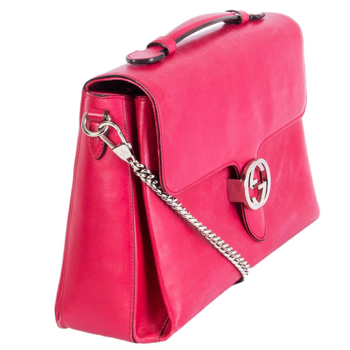 
100% authentic Gucci Medium Dollar shoulder bag in magenta leather featuring silver-tone hardware. Opens with a GG metal clasp and is lined in grey smooth leather. Interior is divided in two compartments with one zipper pocket against the back and