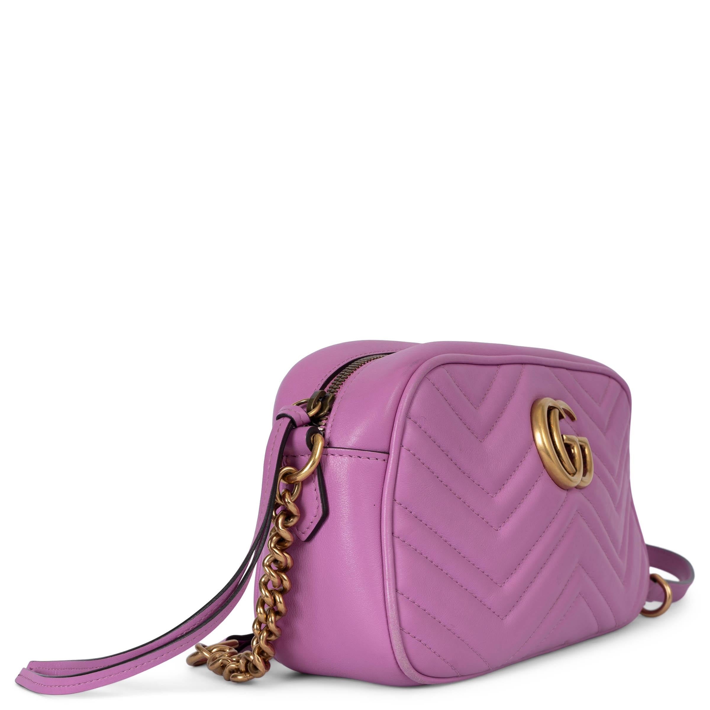 100% authentic Gucci GG Marmont Small Camera shoulder bag in chevron quilted calfskin featuring antique gold-tone hardware. Opens with a zipper on top and is lined nude alcantara with one slit pocket against the back. Has been carried and shows some