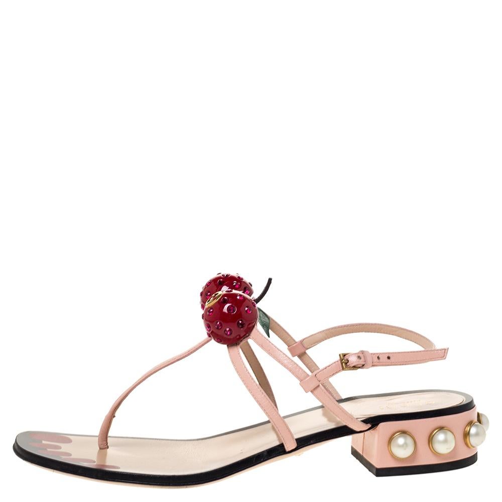No wardrobe is complete without a gorgeous pair of flats to complete your casual looks. This pair from the house of Gucci makes for a very chic addition. Crafted from leather, the sandals have buckle fastening, cherry details and embellished heels