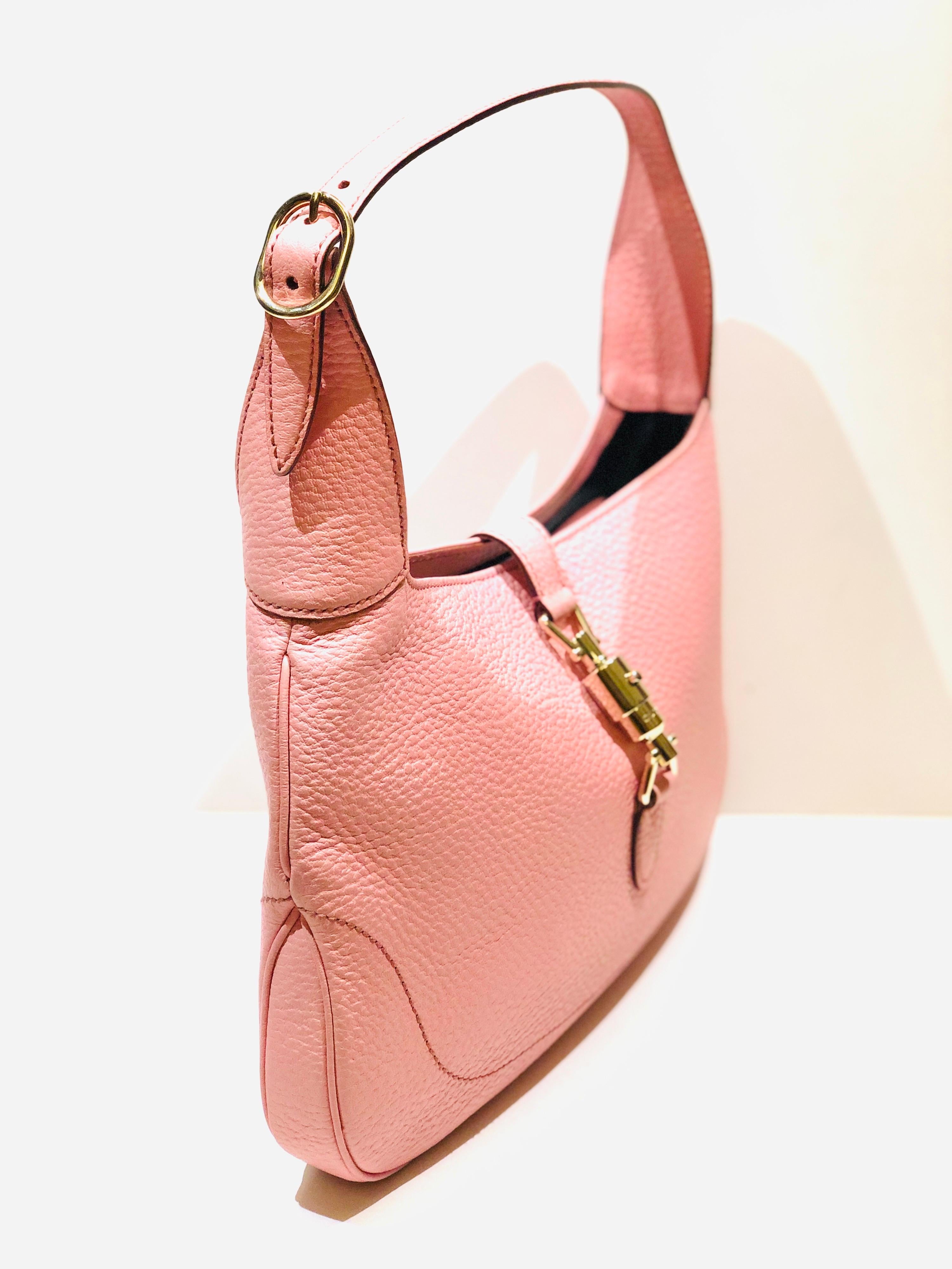 - Gucci pink leather jackie 1961 hobo shoulder bag. You can also carry it like a handbag. 

- Silver-toned hardware. 

- Interior: 1 open pocket and 1 zipper pocket

- Size: Length: 30cm I Height: 20cm I Width: 3cm. Handle Drop: 18cm to 22cm.