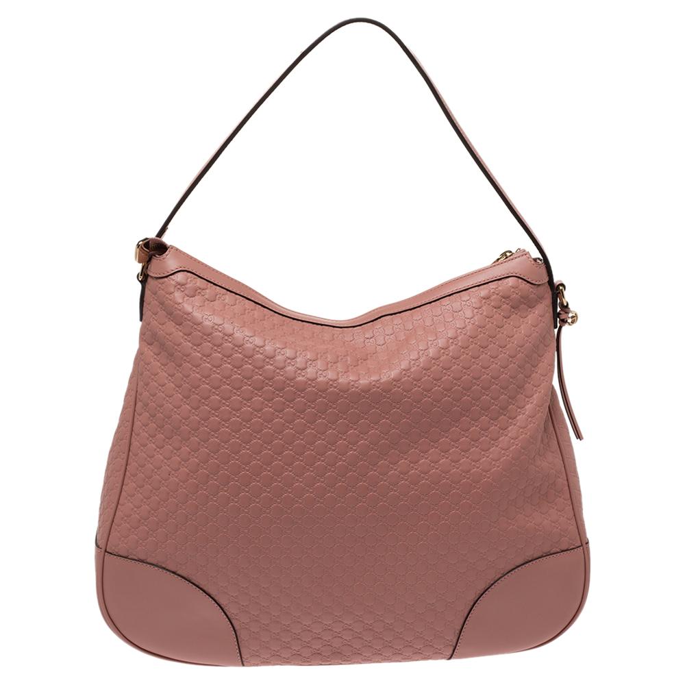 The stunning pink hue of this Gucci hobo bag gives it an elegant finish making a sophisticated option for everyday use. Crafted in Italy with the brand's signature Microguccissima leather, the hobo bag has a fabric-lined interior that is quite roomy