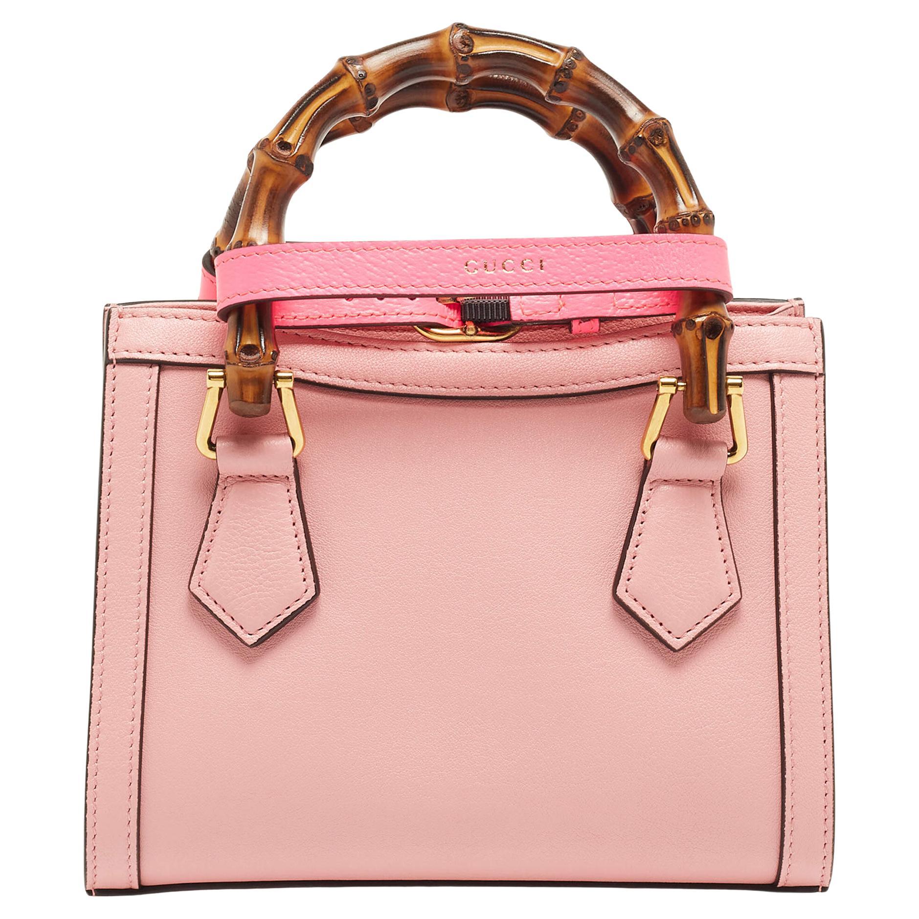 The Gucci Diana tote is a petite, luxurious handbag designed with exquisite pink leather. It features a structured silhouette, iconic double G hardware, bamboo top handles, and a detachable crossbody strap for versatility. This elegant accessory