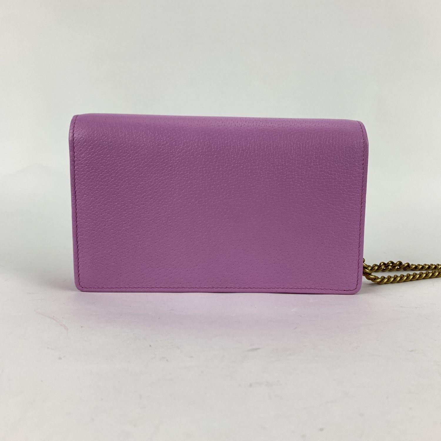 Beautiful Gucci Mini Double G GG Marmont Wallet on Chain in pink leather embellished with crystals. The bag features a flap with button closure, built-in mirror on the reverse of the flap and 1 slit pocket under the flap. Black nylon lining. 1 side