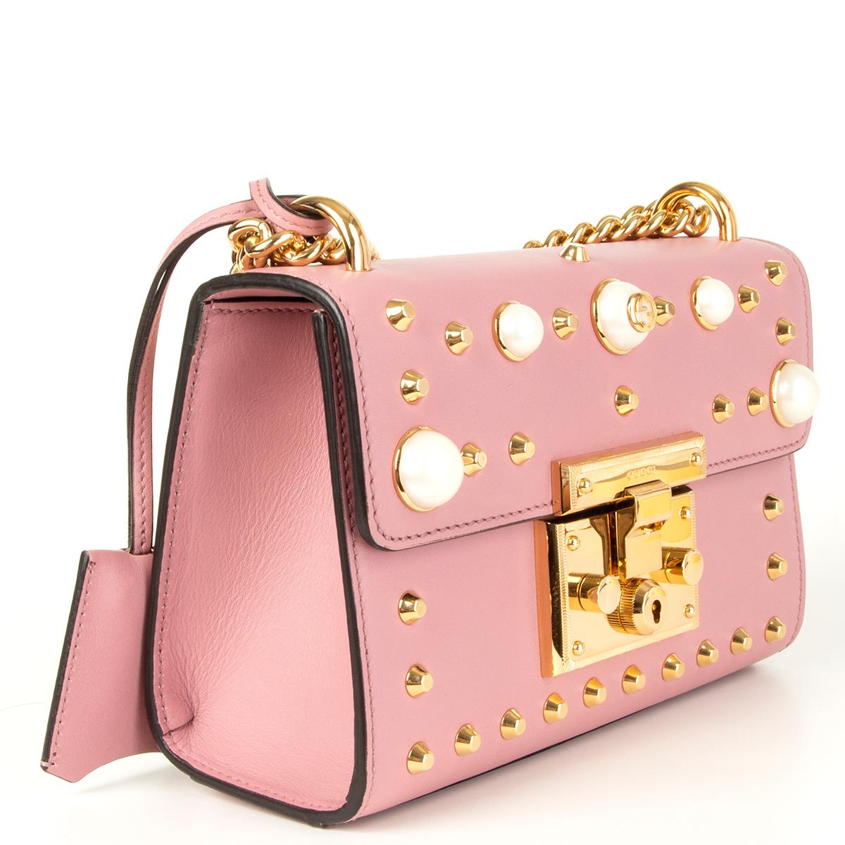 Gucci 'Padlock Small' shoulder bag in baby pink calfskin embellished with pearls and gold-tone metal studds. Lined in tan suede with one open pocket against the back. Has ben carried and is in excellent condition. 

Height 15cm (5.9in)
Width 20cm