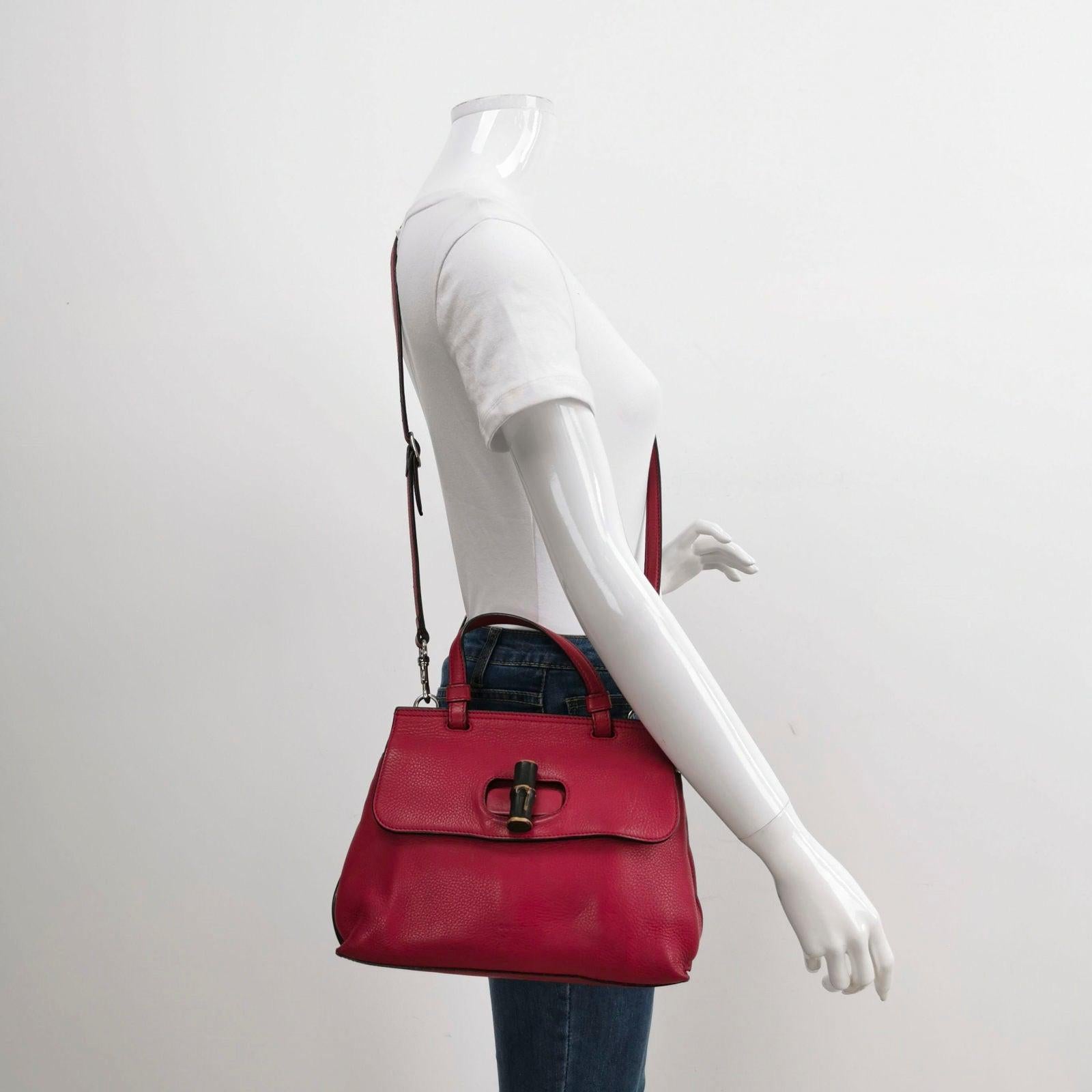 Gucci Pink Leather Small Bamboo Daily Top Handle Bag These are professional photos of the actual bag. CONDITION: VERY GOOD This preloved authentic Gucci bag is in very good condition with moderate signs of use. There may be some rubbing around