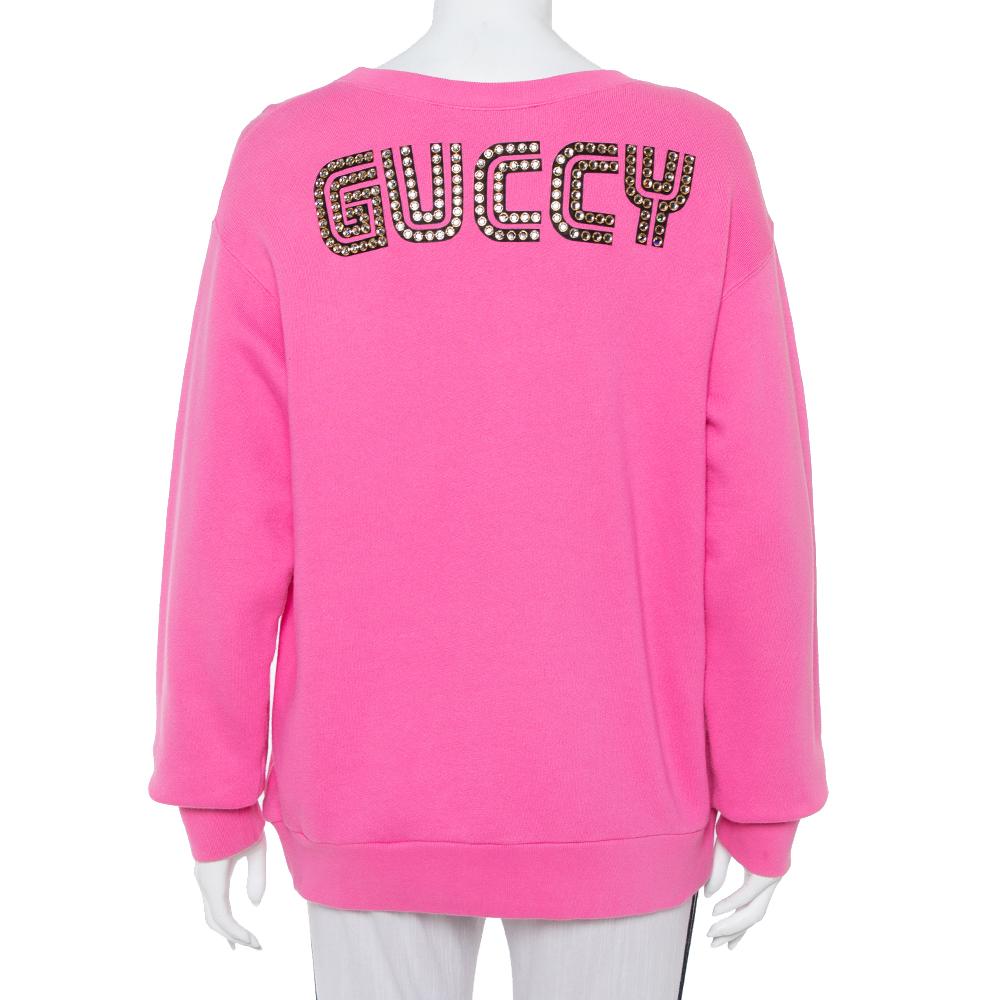 This Gucci sweatshirt features 'Maison de l'Amour' lettering on the front meaning The House of Love along with motifs of Bosco and Orso, Creative Director Alessandro Michele's Boston terriers. Coming in a pink hue, the creation is finished off with