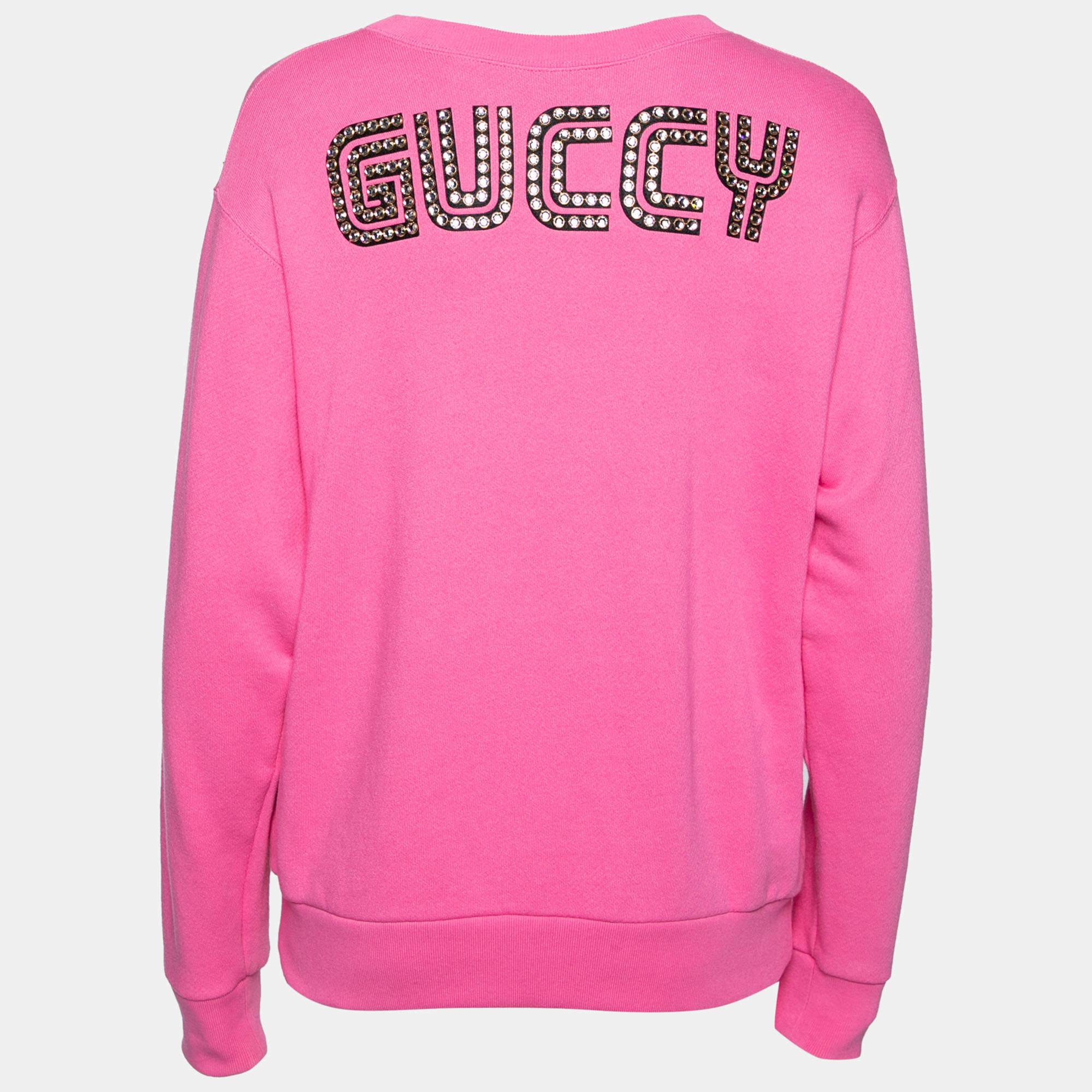 This Gucci sweatshirt features Maison de lAmour lettering on the front meaning The House of Love along with prints of Bosco and Orso Creative Director Alessandro Micheles Boston terriers. Coming in a vibrant pink hue the creation is finished off
