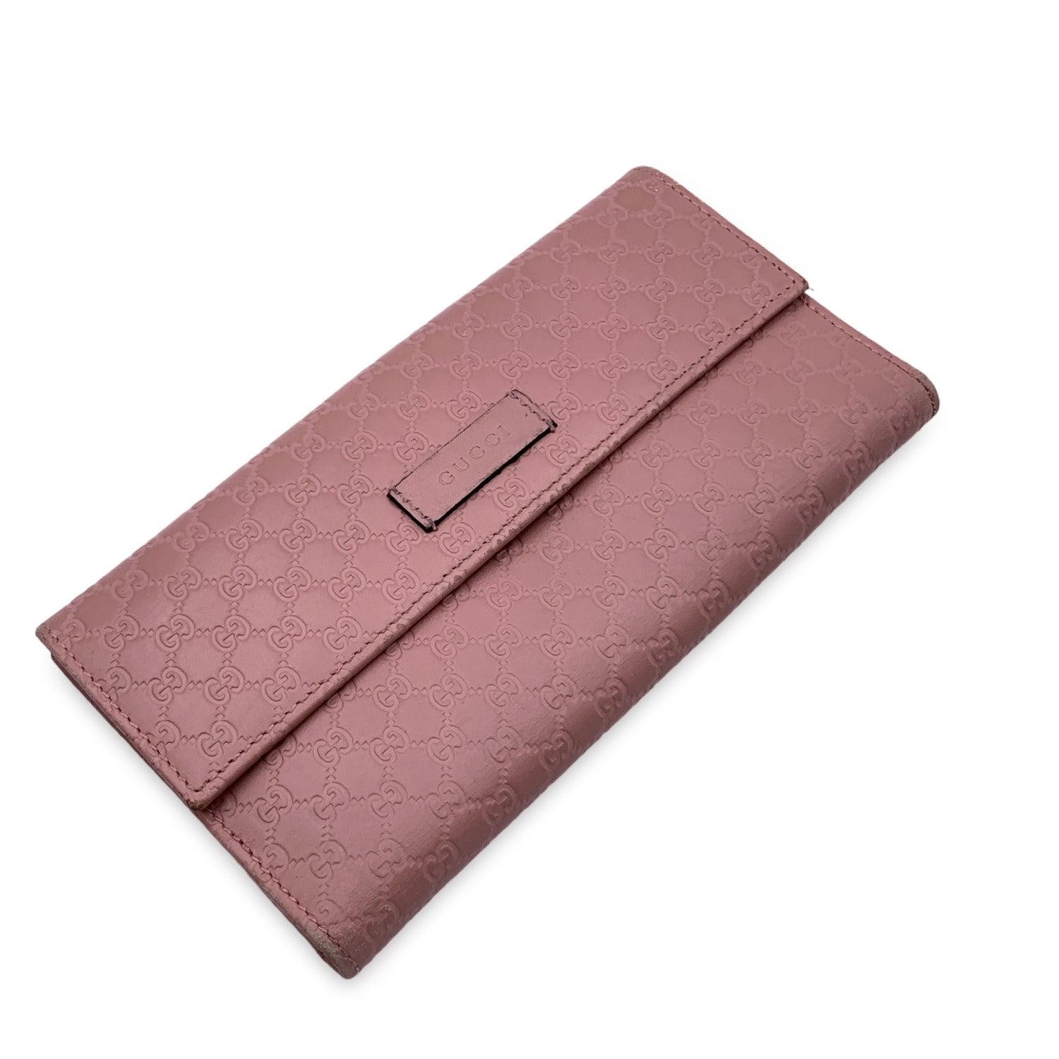 Gucci pink microguccissima continental long wallet. Flap coin compartment with button closure. Inside, 2 compatments, 7 credit card slots, 2 flat open pockets. 'Gucci - Made in Italy' engraved inside. Serial number engraved inside Details MATERIAL: