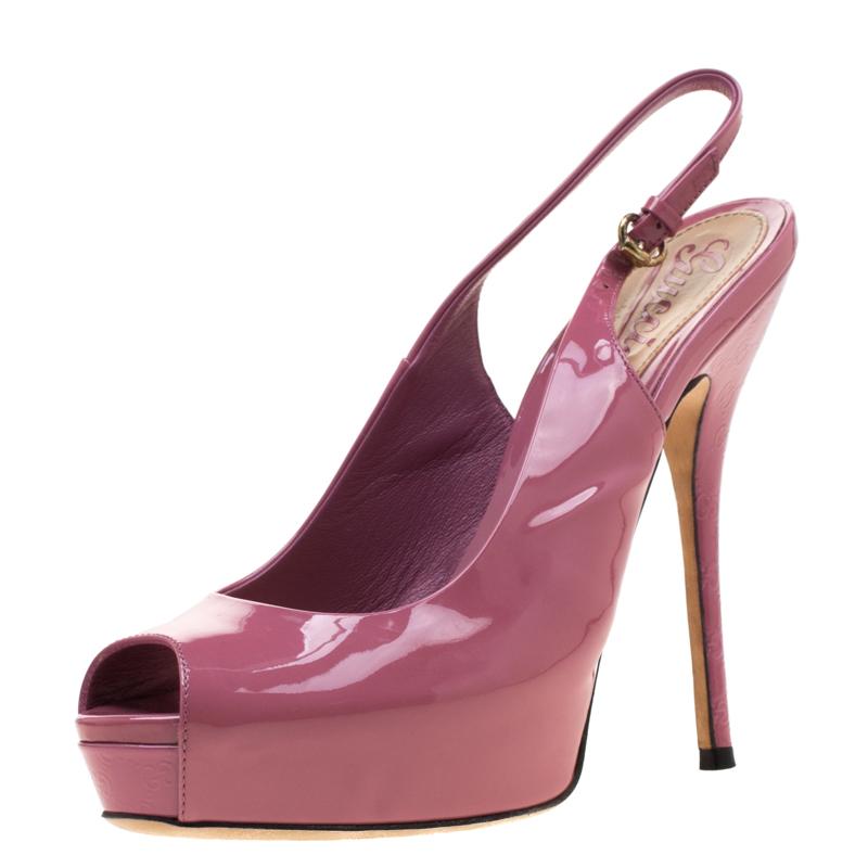 Sure to fetch you admiring glances and make you shine all day long, these pink Sofia sandals from Gucci are a must-buy! They are crafted from patent leather and designed with Microguccissima embossings on the platforms and 13.5 cm heels.

Includes: