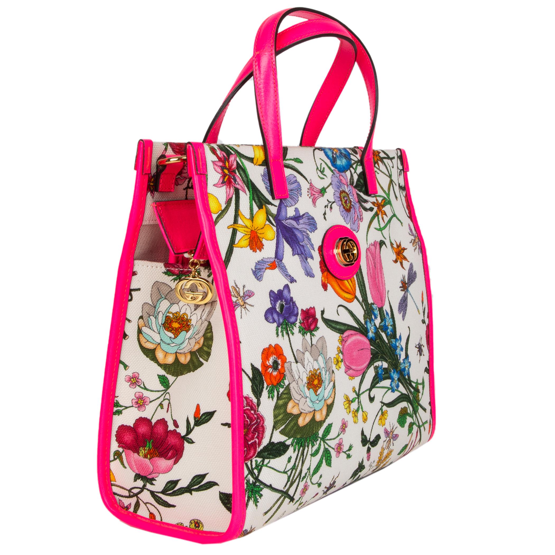 Gucci Neon Flora Medium Tote in multicolor flora canvas with neon pink leather details. Detachable and adjustable shoulder strap. Closes with a zipper on top. Unlined with an open pocket against the back. Brand new. Comes with dust bag.

Height 25cm