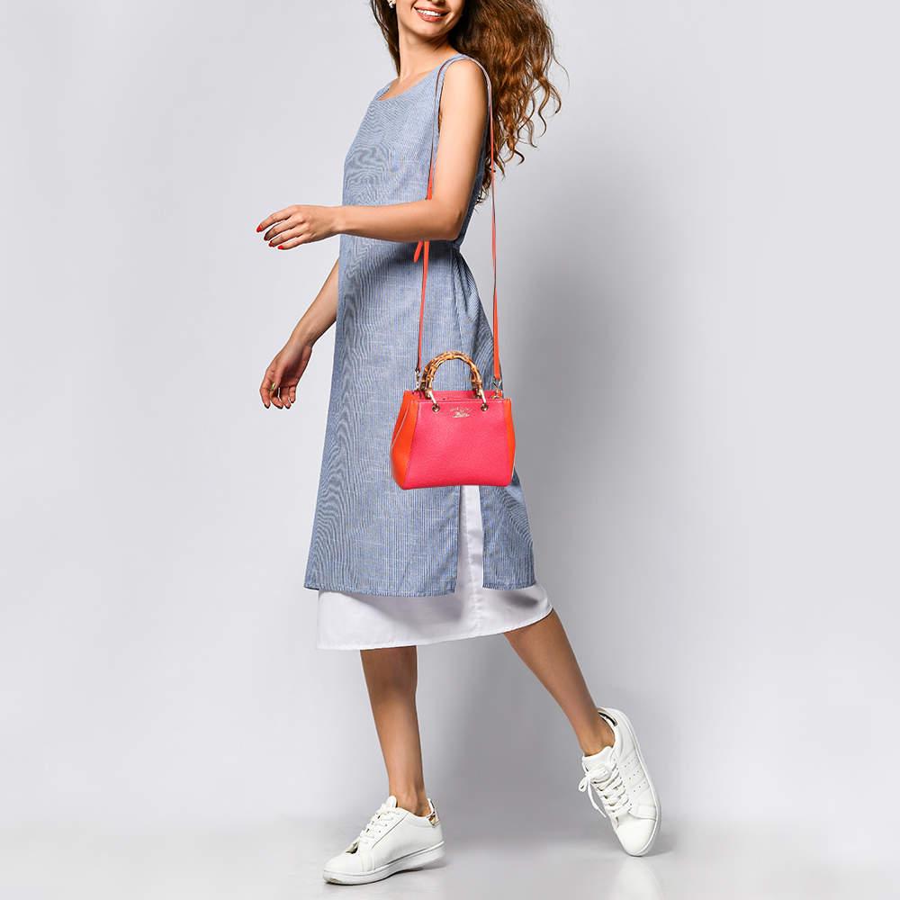 Handbags as fabulous as this one are hard to come by. So own this gorgeous tote from Gucci today and light up your closet Crafted from off white leather this tote has a spacious fabric interior and is wonderfully held by two Bamboo handles making