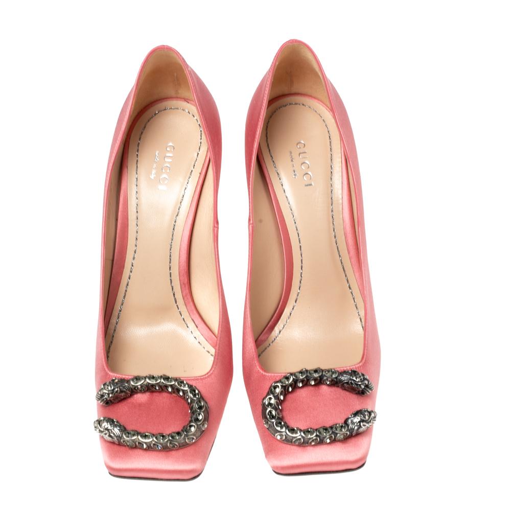Gucci's timeless aesthetic, love for motifs from mythologies, and stellar craftsmanship in shoemaking are evident in these stunning pumps. They flaunt square toes with Dionysus accents on the vamps, comfortable leather-lined insoles, and 11 cm