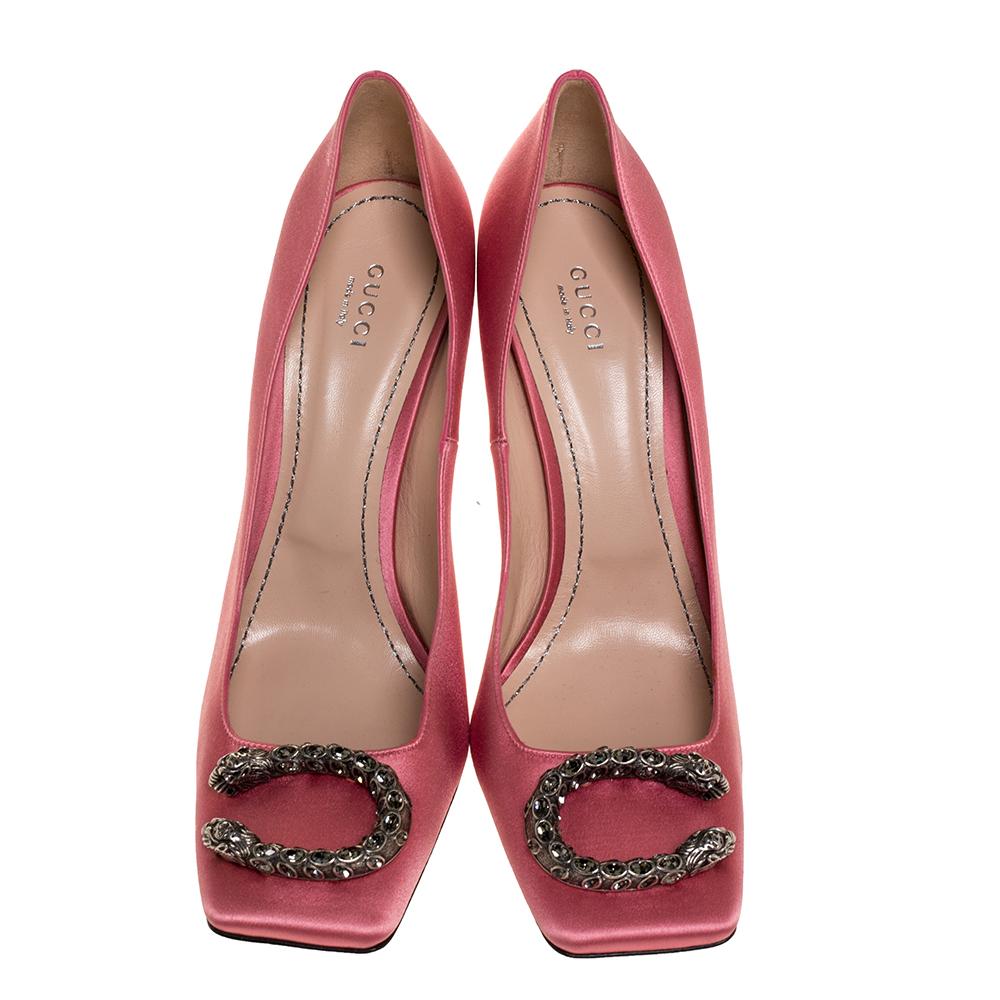 You'll love to walk in these pumps from Gucci that look very stylish. These pink pumps are crafted from satin and feature a recognizable silhouette. They flaunt square toes with Dionysus accents on the vamps, comfortable leather-lined insoles and