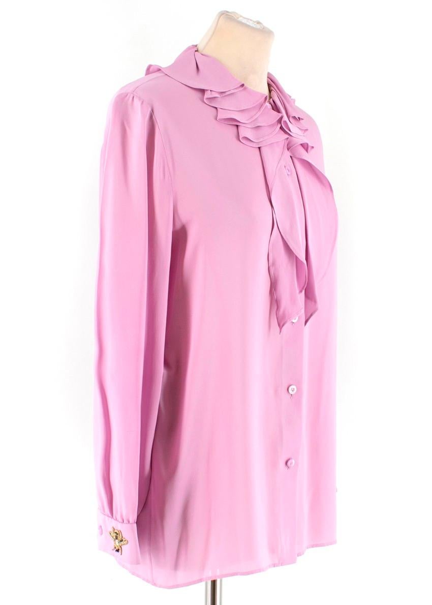 Gucci Pink Silk Ruffled Collar Tie-neck Blouse

- Pure pink silk blouse
- Ruffled collar
- Tie-neck detail
- Button front fastening
- Relaxed fit
- Buttoned cuffs
- Gold-tone bee embroidered right cuff

Please note, these items are pre-owned and may