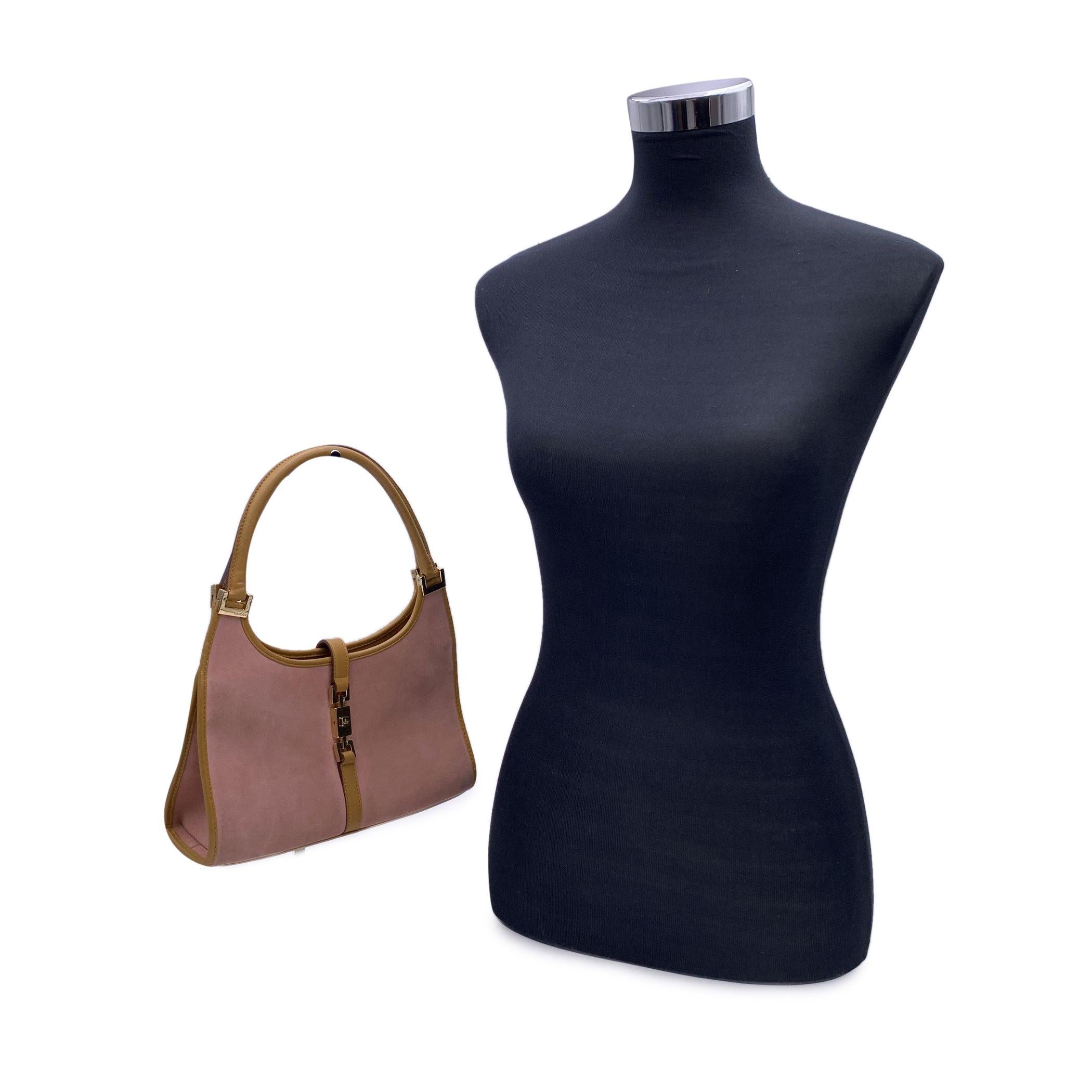 Beautiful Gucci 'Jackie' hobo bag, crafted in pink suede abd beige leather. Gold metal hardware. Fold over strap with push closure. Beige monogram canvas lining. 2 side zip pocket inside. 'Gucci - Made in Italy' tag inside (with serial number on its