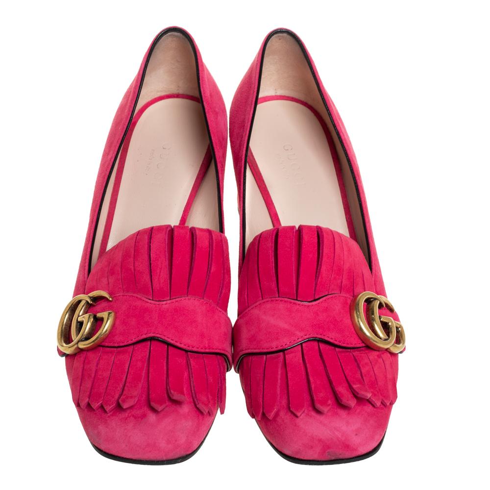 Stylish and elegant, these Gucci loafer pumps are a must-have design. They've been crafted from pink suede and styled with folded fringes with the brand's signature GG on the uppers. Square toes, comfortable insoles, and block heels complete the