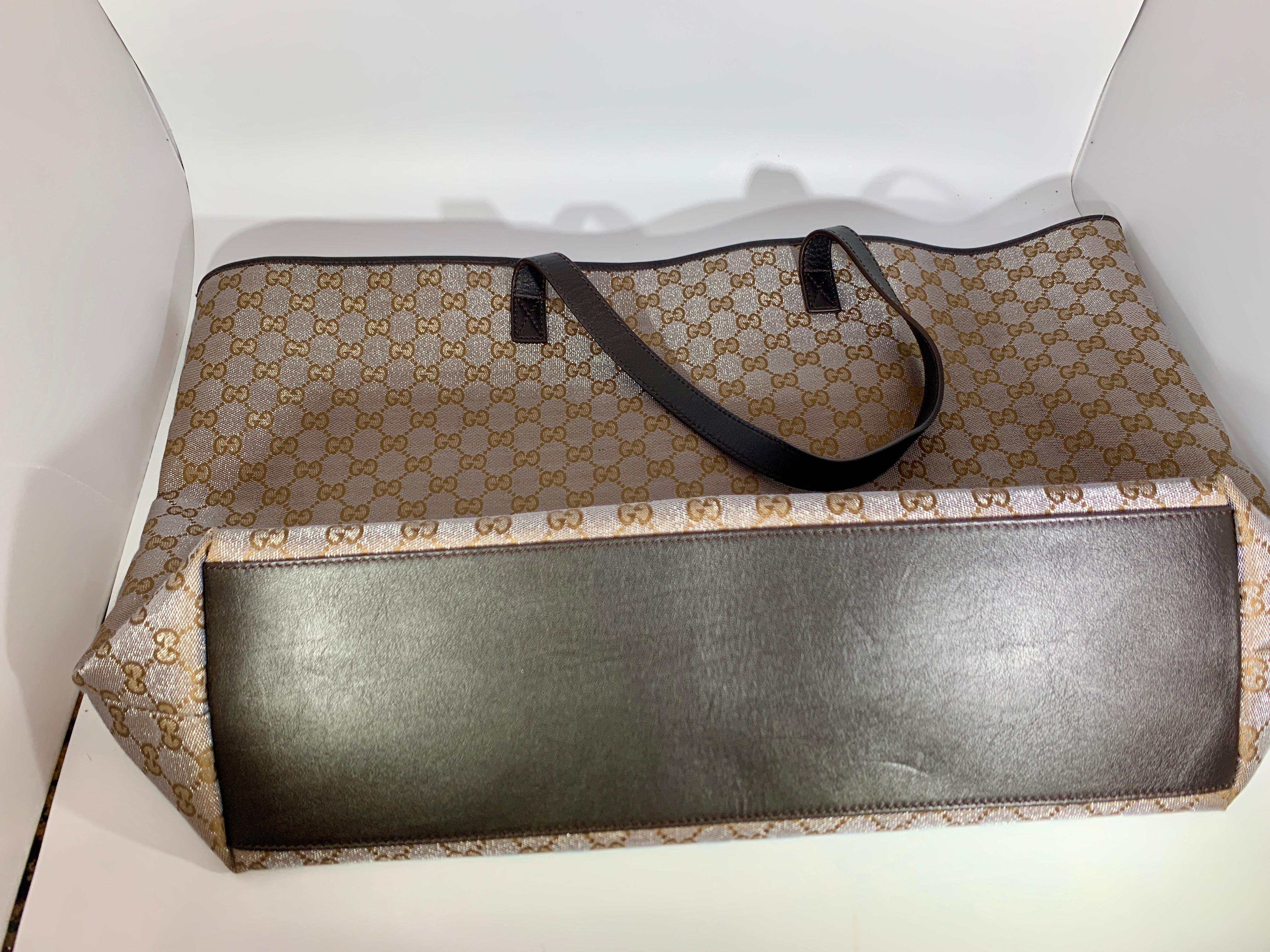 Gucci Plus Vintage GG Monogram Canvas Large Tote Shoulder Bag Silver Like New
This is an Authentic Vintage Gucci Plus large Tote
The color silver and brown , its some what dressy as there is a shine and glitter in the silver color 
Most beautiful