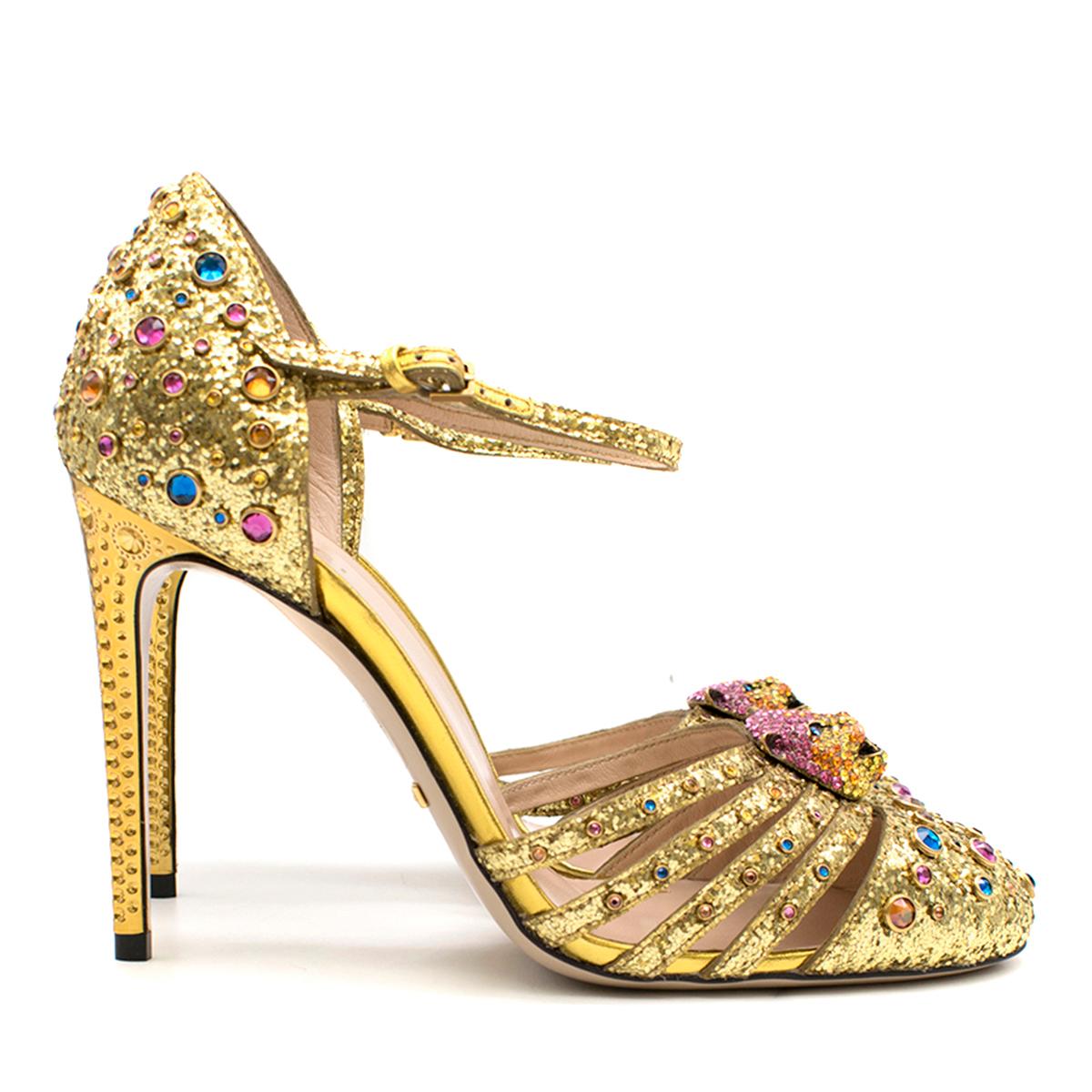 Gucci Polignac Feline Glitter Metallic Leather Pumps

-gold, glitter metallic and leather
-Multicolored jewels
-Crystal Tiger face on tops
-Adjustable ankle strap
-Heel panels
-Gold detail engraving on heel
-Nude leather insole
-Gold 