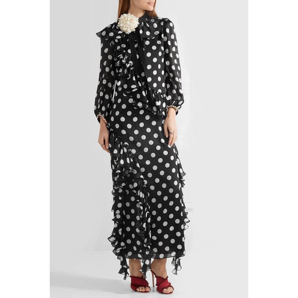 This ruffled polka dot gown, shown here in black and white silk, features a tied neckline, a polka dot print, a ruffled design, three-quarter length sleeves, a long length, a flower brooch and embellished cuffs.
Outer: Cotton 50%, Viscose 50%, Silk