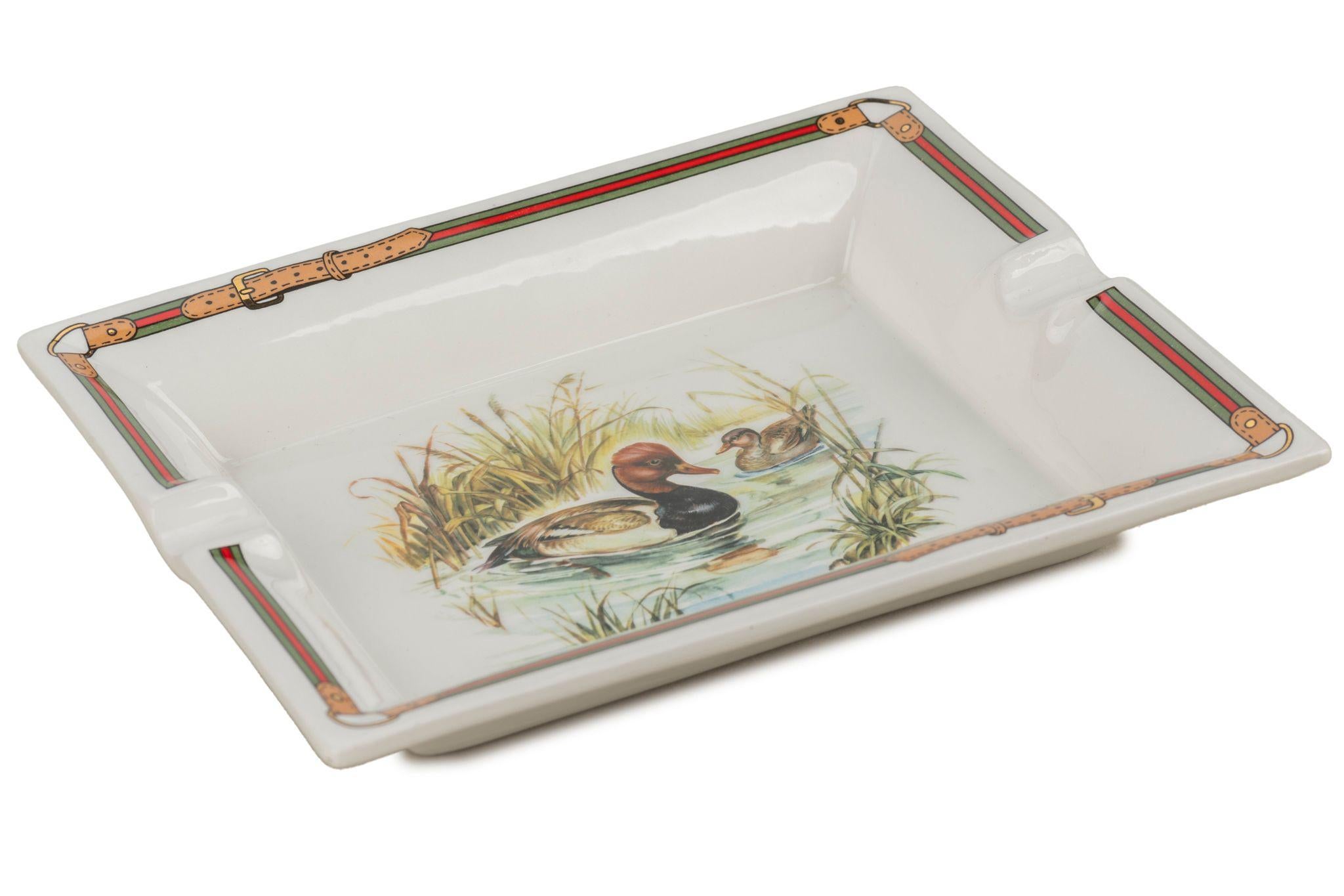 Gucci vintage porcelain ashtray with ducks design, signature red and green trim. Excellent condition.