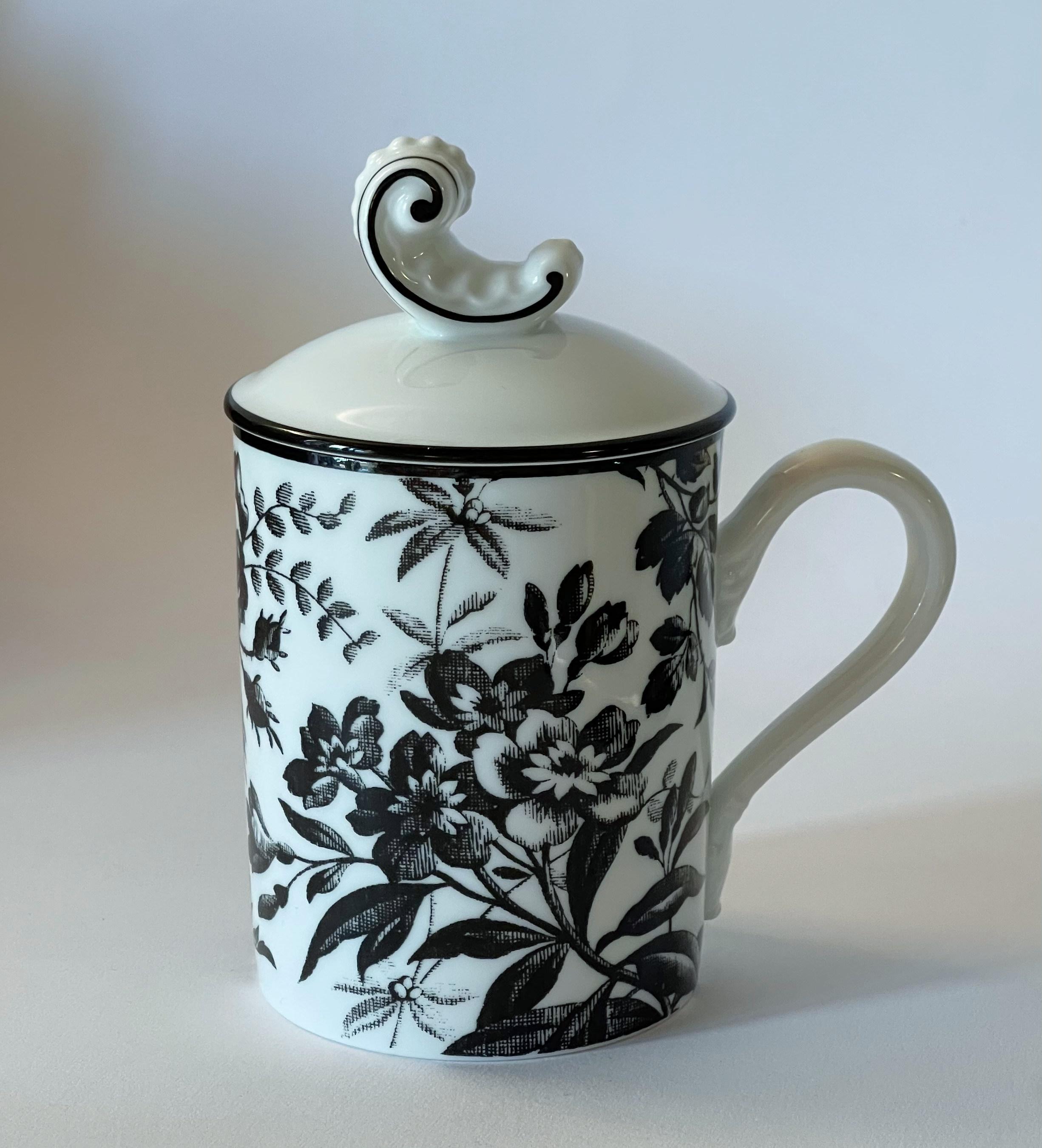 Gucci white porcelain mug with flowers encircling the cup and a scroll on the lid, from Richard Ginori 1735 collection / Made in Italy
Original stamp on the base / comes in original box
Diameter: 3 inches, height 5.5 inches
1 available in stock in