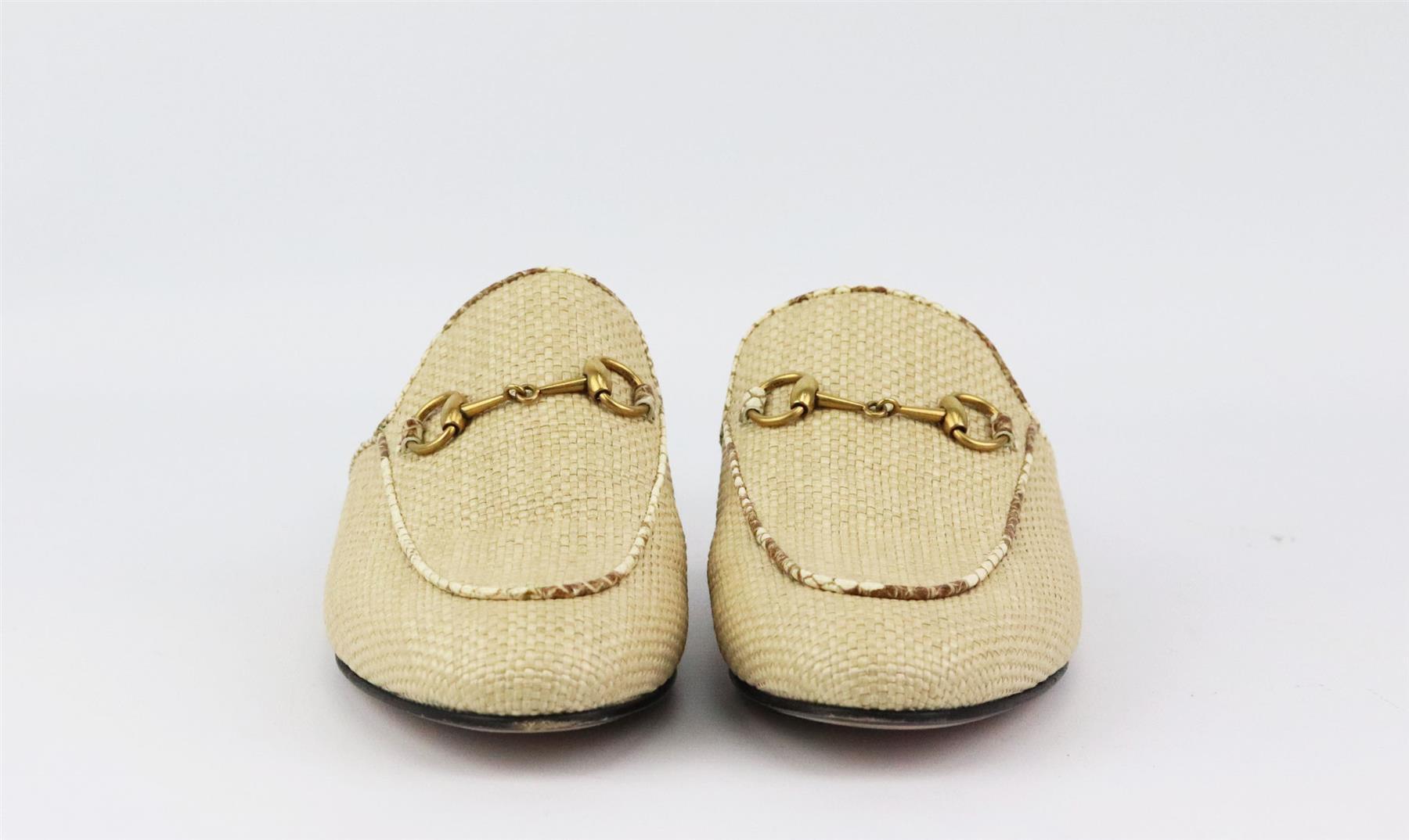 These ‘Princetown’ slippers are crafted from textured snakeskin trimmed beige woven raffia and are a versatile option for the office or evenings out, the almond-toe pair is adorned with the house's iconic horsebit plaque. Sole measures approximately