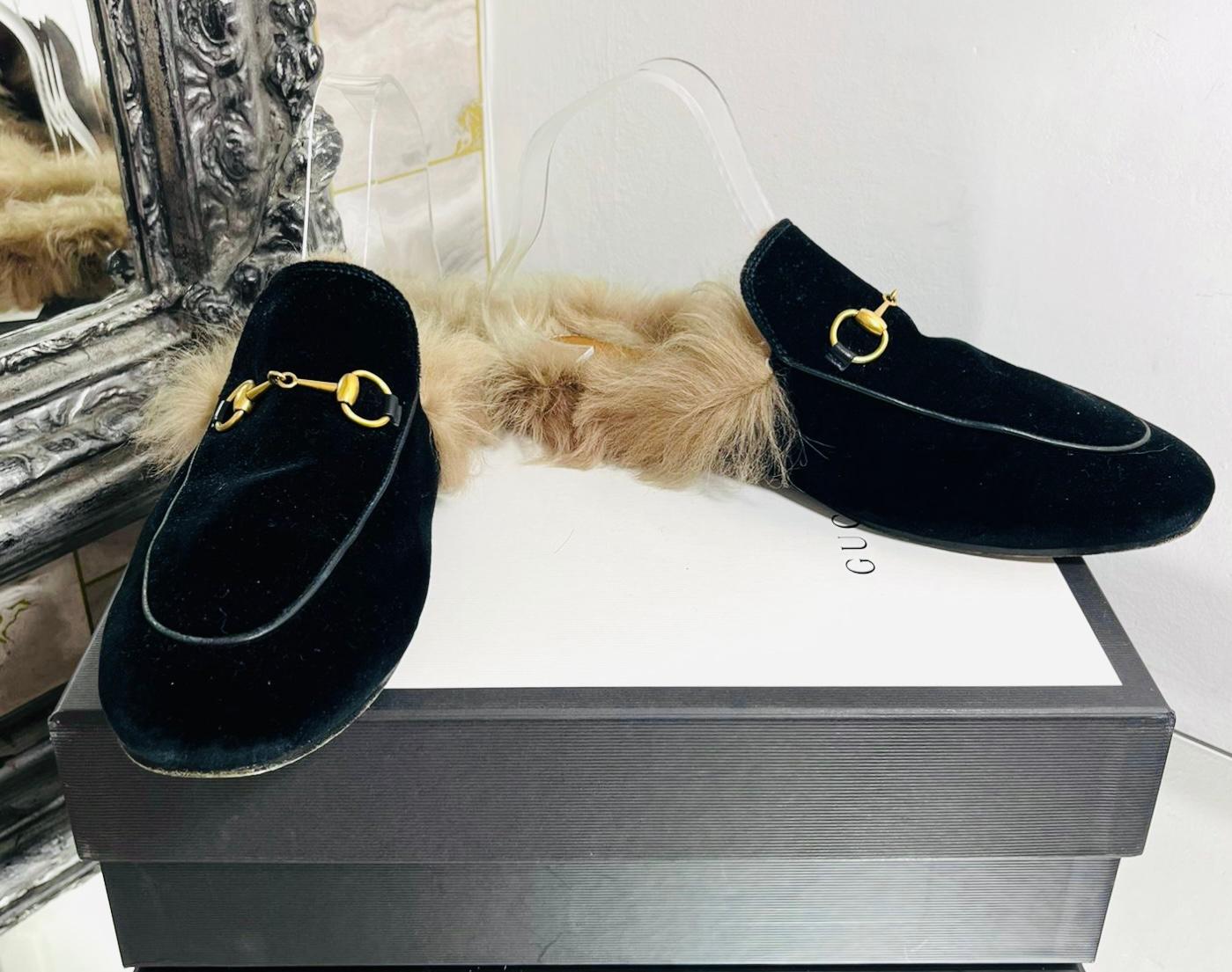 Gucci Princetown Suede Shearling-Lined Mules

Black slip-on mules designed with the brand's signature gold Horsebit embellishment to the front.

Detailed with shearling lining, almond toes and flat leather soles.

Size – 40

Condition – Very