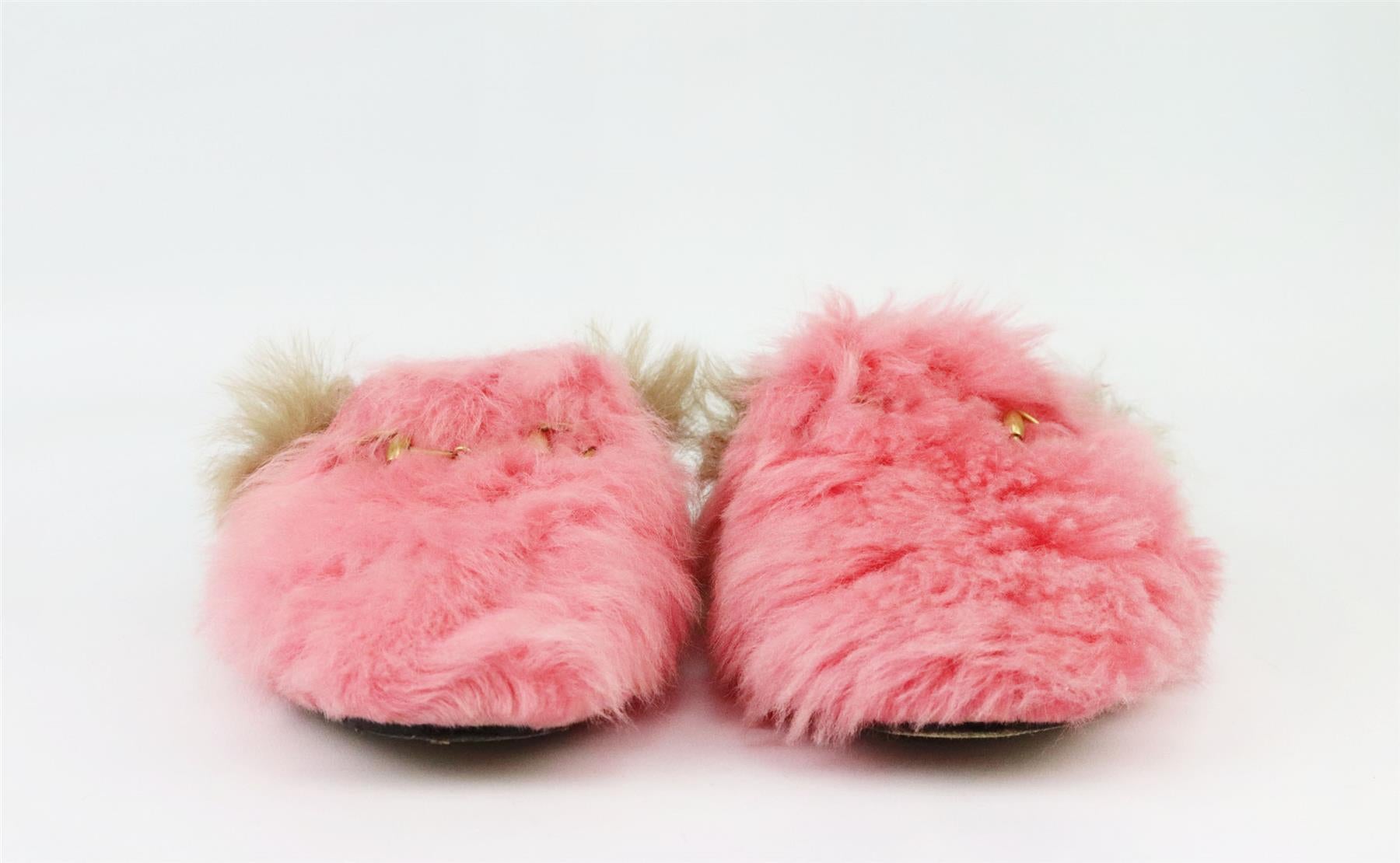 These ‘Princetown’ slippers by Gucci are one of the newest versions, crafted from fluffy pink shearling with a contrasting brown lining, the gold horsebit is a signature detail. Sole measures approximately 10 mm/ 0.5 inches. Pink shearling, brown
