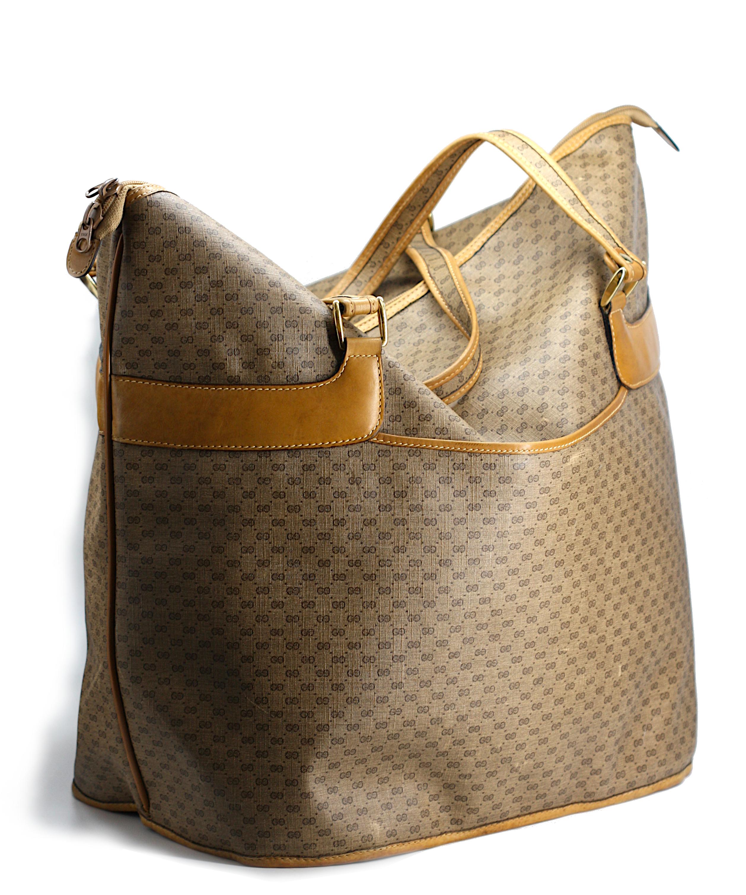 
Gucci Printed Canvas and Leather Large Travel Bag
With gold-toned hardware, tan leather borders and a shoulder strap, the exterior with an open pocket.
Height 18 in., Width 16.5 in., Depth 11 in.