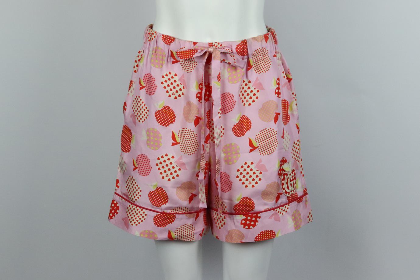 Gucci printed silk twill shorts. Pink, white and red. Pull on. 100% Silk; fabirc2: 100% cotton; fabric3: 50% cotton, 50% polyester. Size: IT 42 (UK 10, US 6, FR 38). Waist: 30 in. Hips: 42.6 in. Length: 17 in. Inseam: 6 in. Rise: 12.5 in. Good