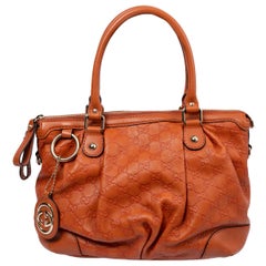 GUCCI - Sac à bandoulière SUKEY MEDIUM orange en cuir Guccissima