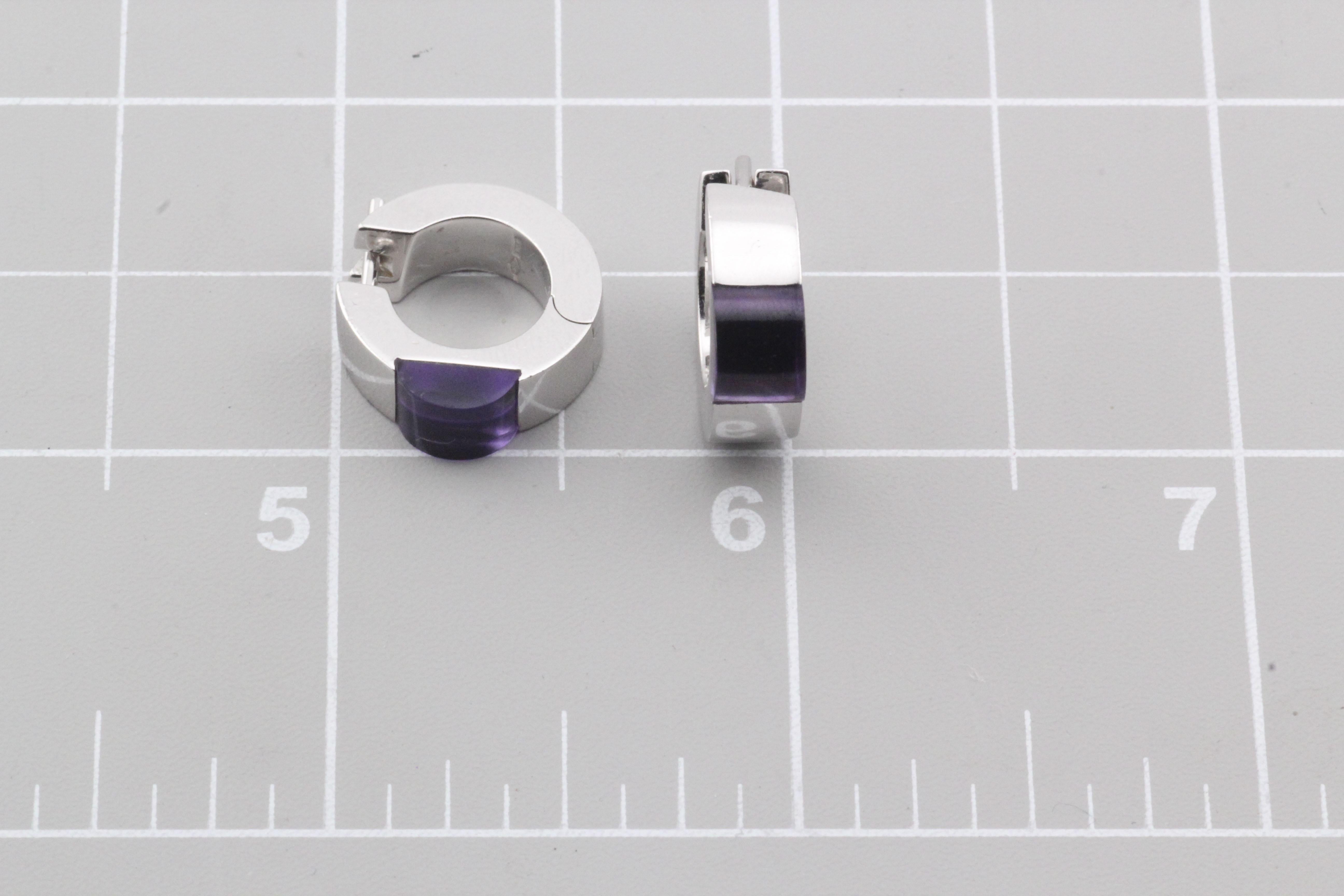 The Gucci Purple Amethyst 18K White Gold Hoop Huggie Earrings are a stunning representation of luxury and sophistication, seamlessly blending contemporary design with classic elegance.

Crafted from premium 18k white gold, these huggie earrings