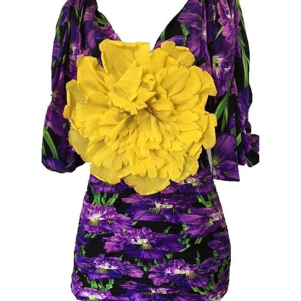 Embracing purple Flower-embellished ruched silk
Tonal-purple, black, tonal-green, yellow floral print
Deep V-front and back neck
Elbow-length sleeves
Gathered cuffs
Self-fastening shoulder ties
Pleated front and back panels
Centre-front tonal-red