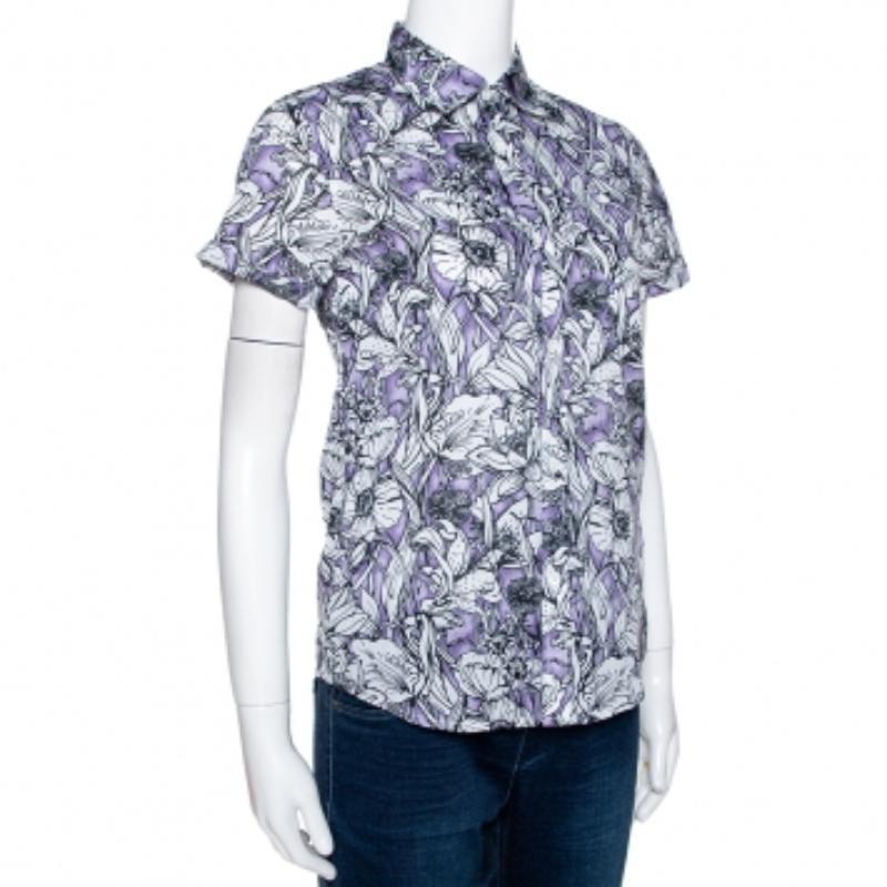 This shirt from the luxury house of Gucci is an example of classic designing. If you're looking for a simple and chic look, this is the shirt for you. It is crafted from cotton and carries a lovely purple floral print throughout. It has short