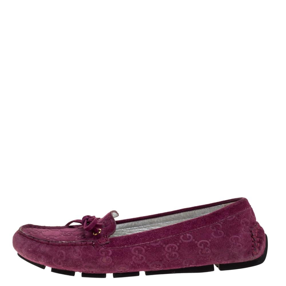Add value to your ensemble by slipping into this pair of loafers from Gucci. Made from purple GG-detailed suede, they feature bow details on the uppers and leather lining. Soft and plush, these shoes are sure to bring you comfort.

Includes:Original