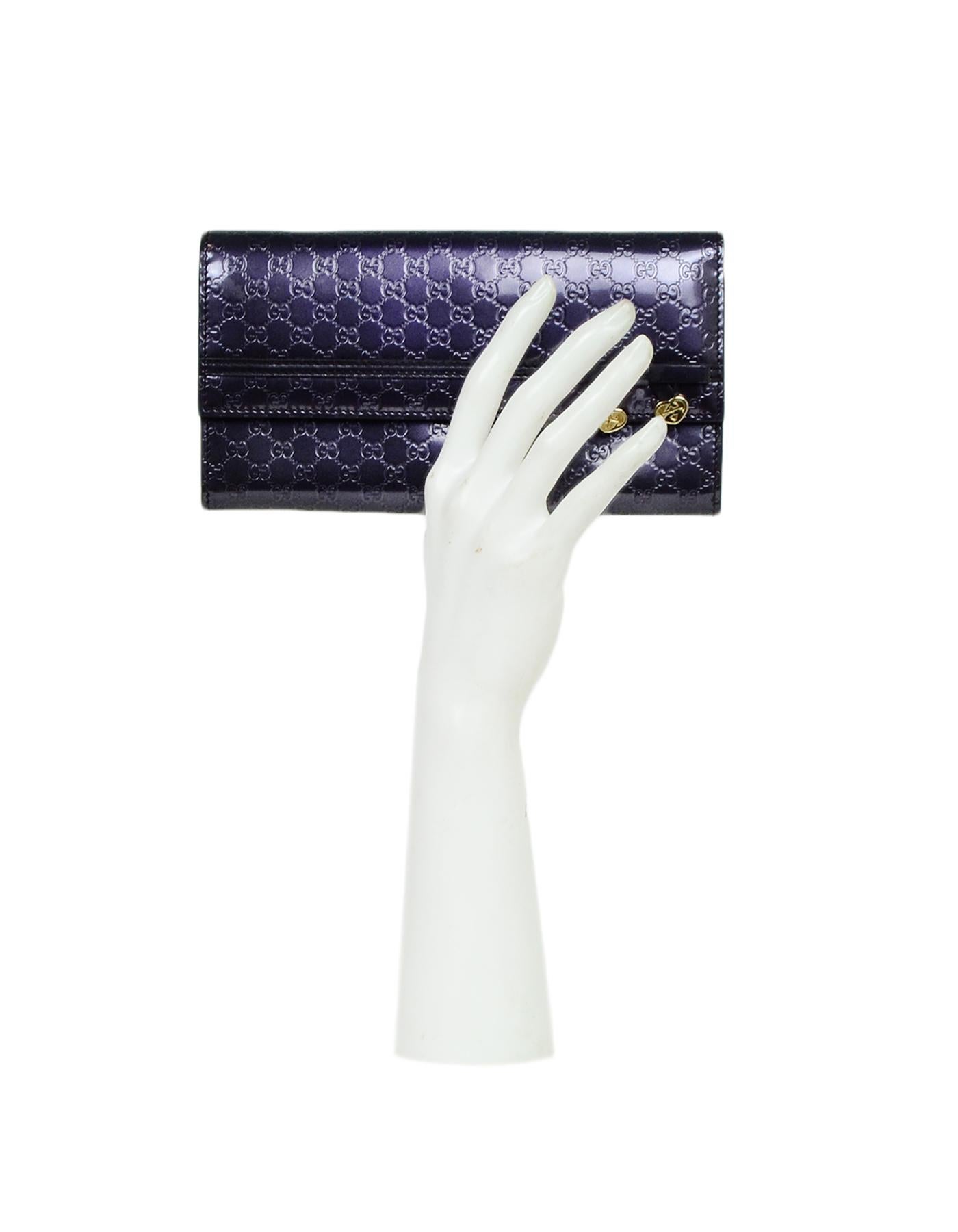 Gucci Purple Glazed Leather Micro Guccisima Monogram Candy Shine Continental Wallet

Color: Purple
Hardware: Goldtone hardware
Materials: Glazed leather
Lining: Purple textile lining
Closure/Opening: Top flap with snap
Exterior Pockets: One slit