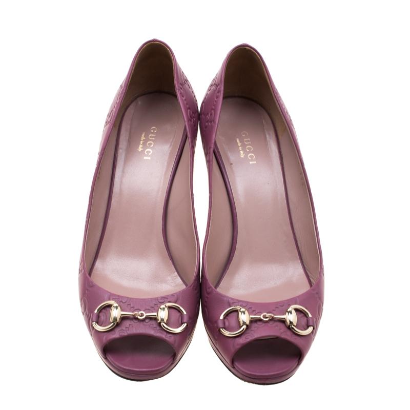 These classic Gucci peep-toe pumps make for an ideal formal and informal adornment. Crafted in purple Guccissima leather, they feature gold-tone Horsebit detailing on the vamps and come with 9cm heels and leather-lined insoles.

Includes: Original