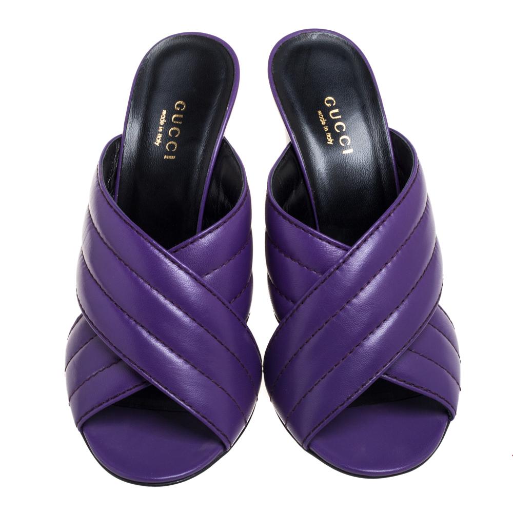 These mule sandals from Gucci are simply delightful! The purple beauties are crafted from leather and feature an open-toe silhouette. They flaunt quilted crisscross vamp straps and come equipped with comfortable leather-lined insoles. They are
